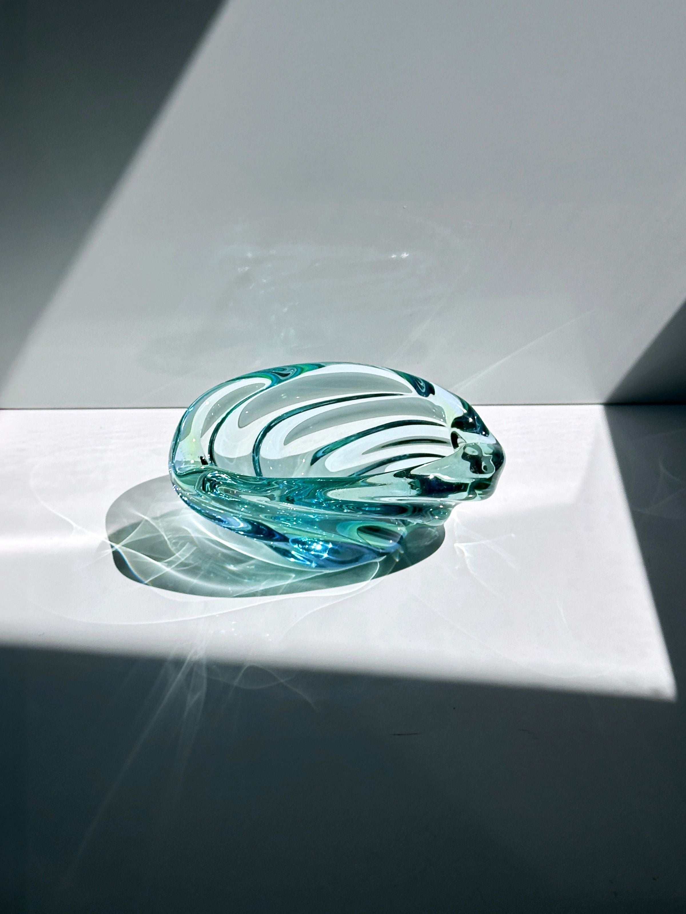 Turquoise glass vide-poches detail showing sculptural curved form
