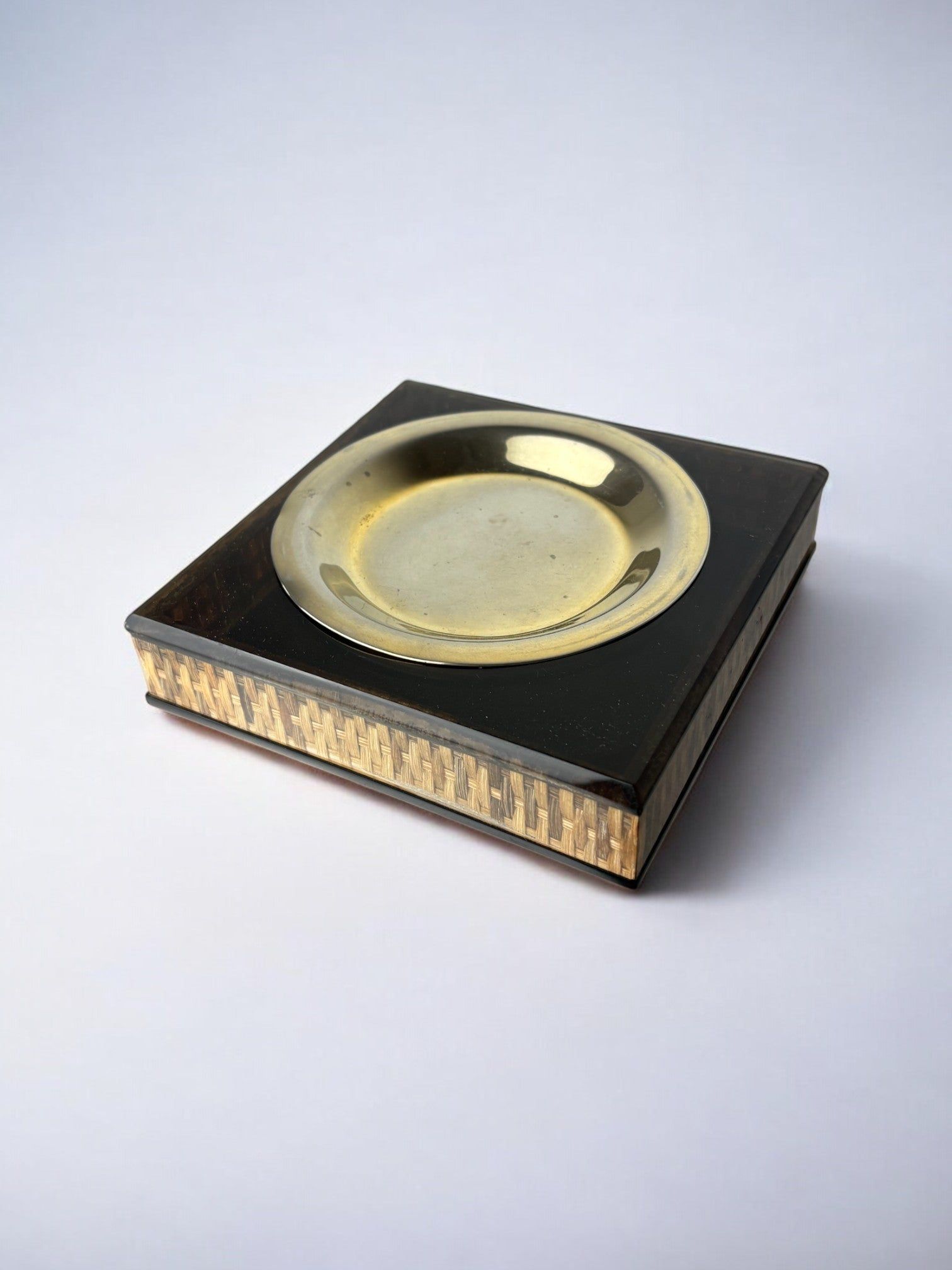 Lucite & Rattan Ashtray, 1970s — top view on neutral background