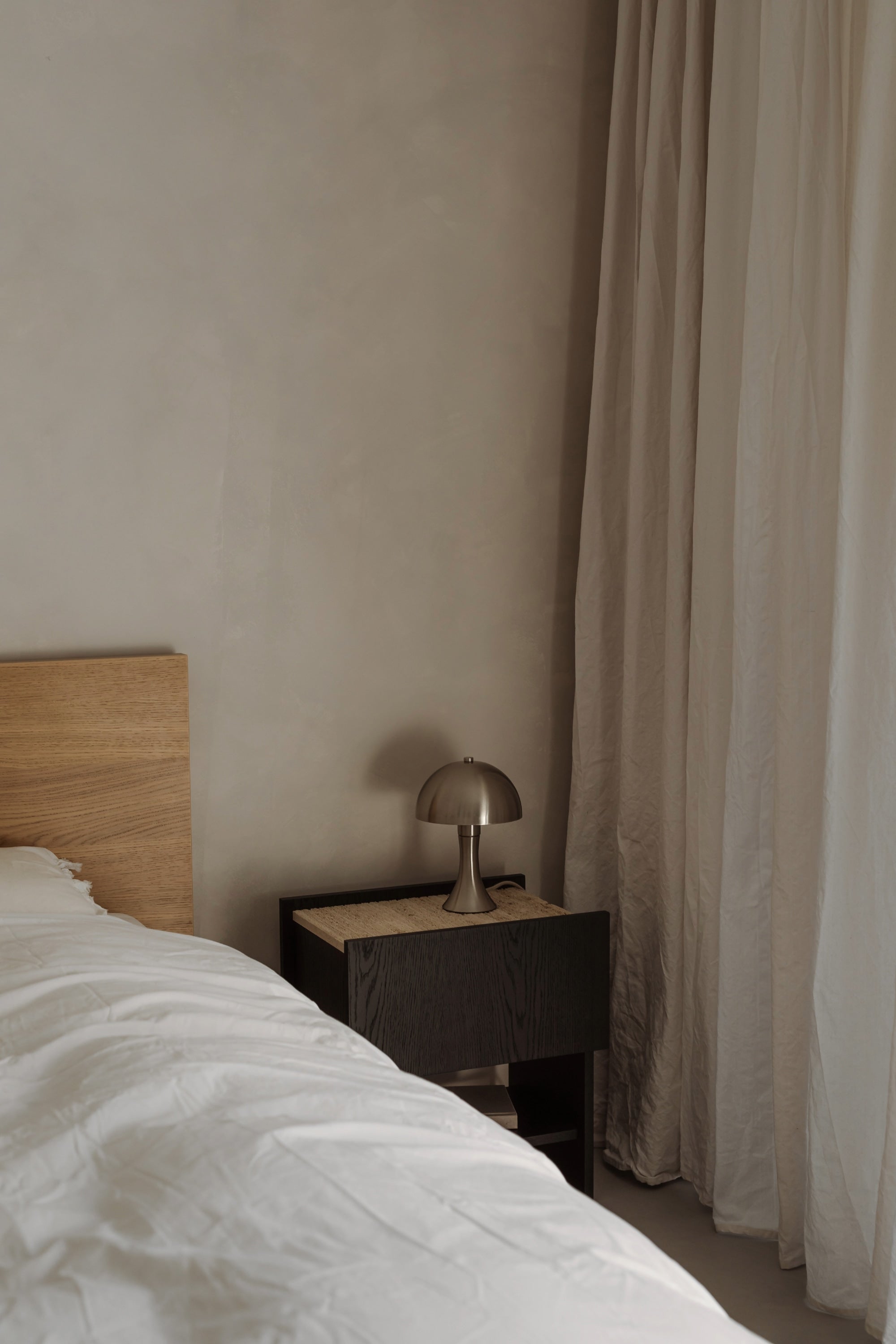 NOTO Night Stand — corner view with wooden top and lamp
