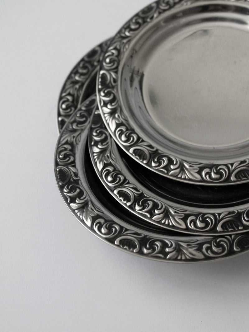 WMF "Baroque" Stainless Steel Tray And Coasters Set — close-up of coasters with ornate detailing