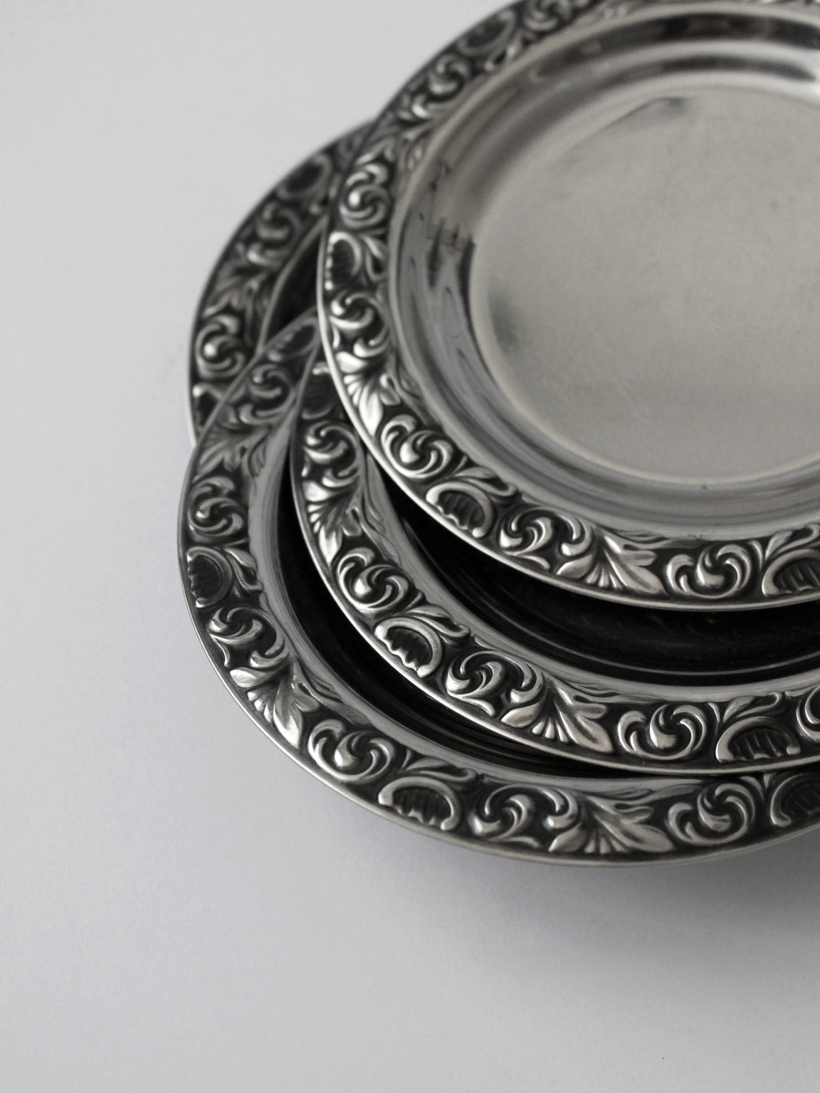 WMF "Baroque" Stainless Steel Tray And Coasters Set — close-up of coasters with ornate detailing