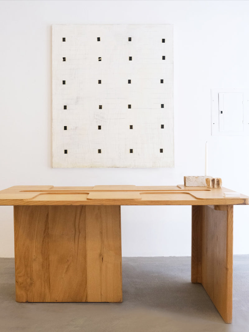 Henry Table' in Chestnut Wood — front view with minimalist art backdrop