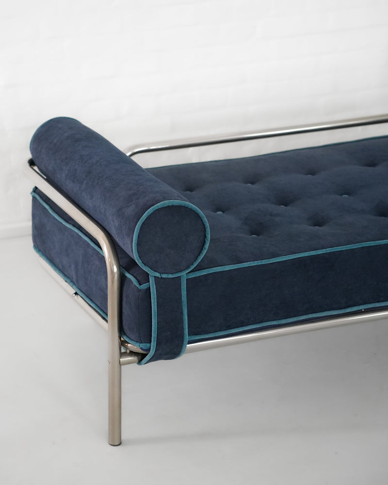 Blue velvet Locus Solus daybed detail showing cylindrical armrest