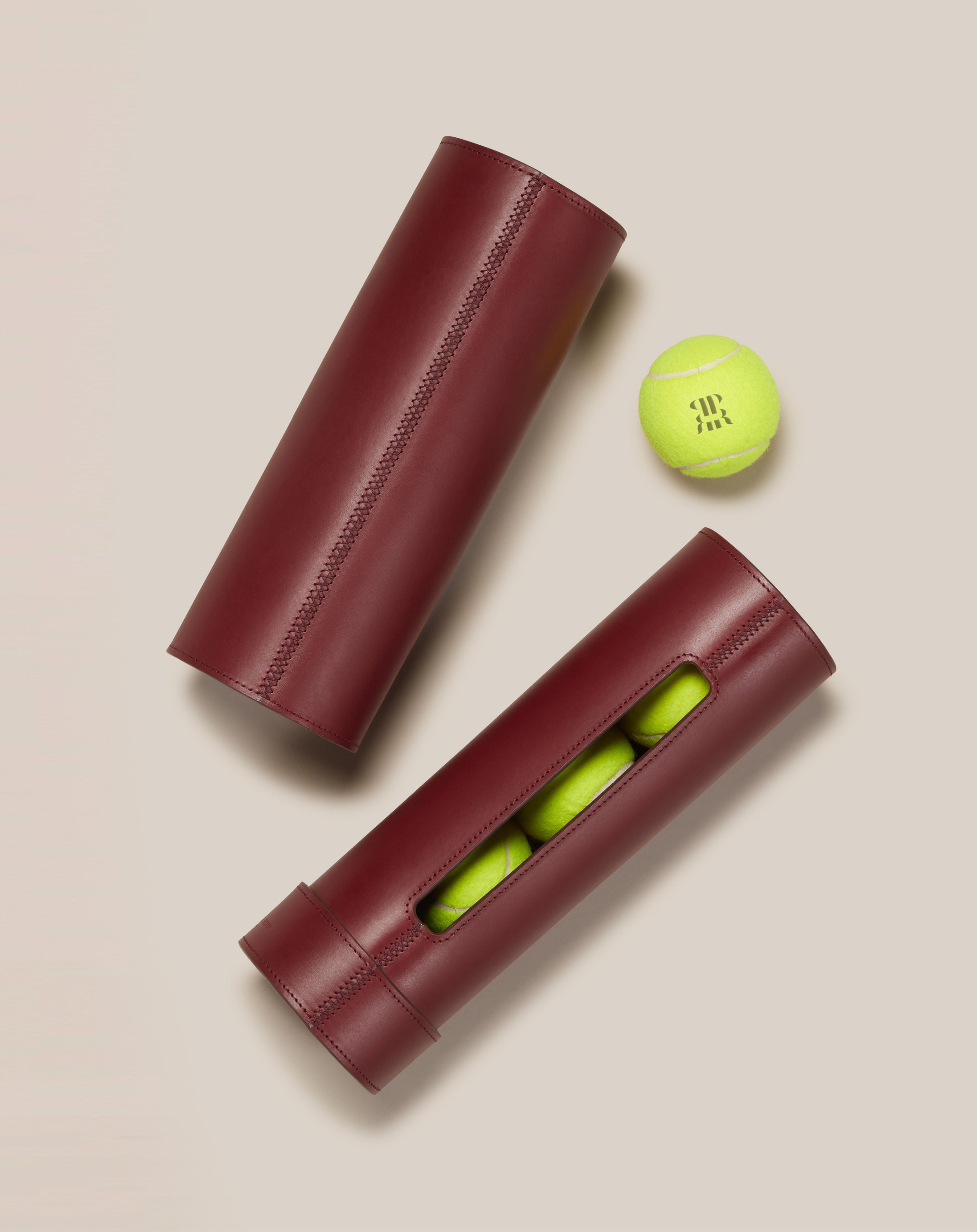 Leather Tennis Ball Holder — close-up showing burgundy leather with tennis balls inside