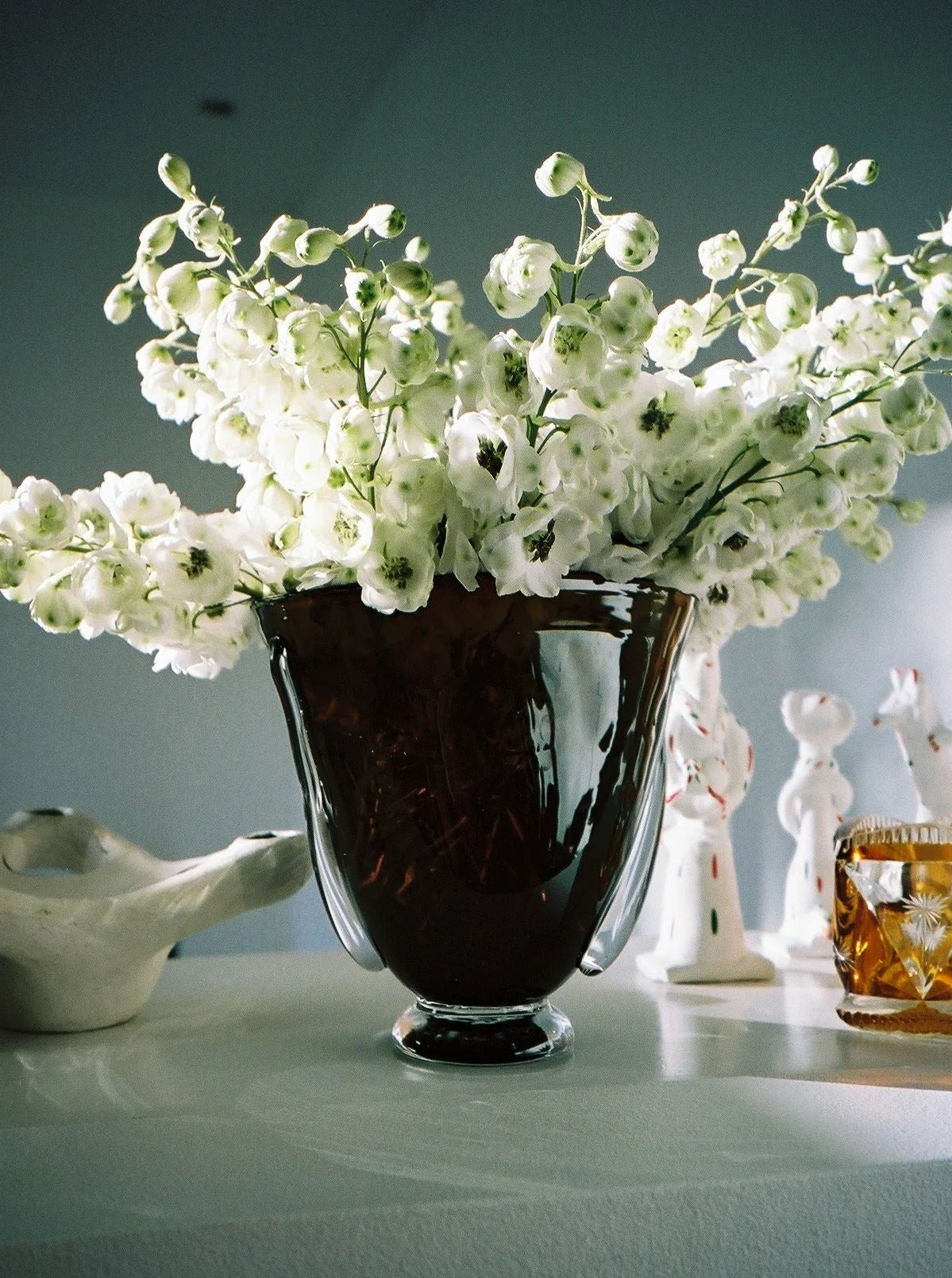 Mouth Blown Karl Vase — top view with white flowers in brown glass