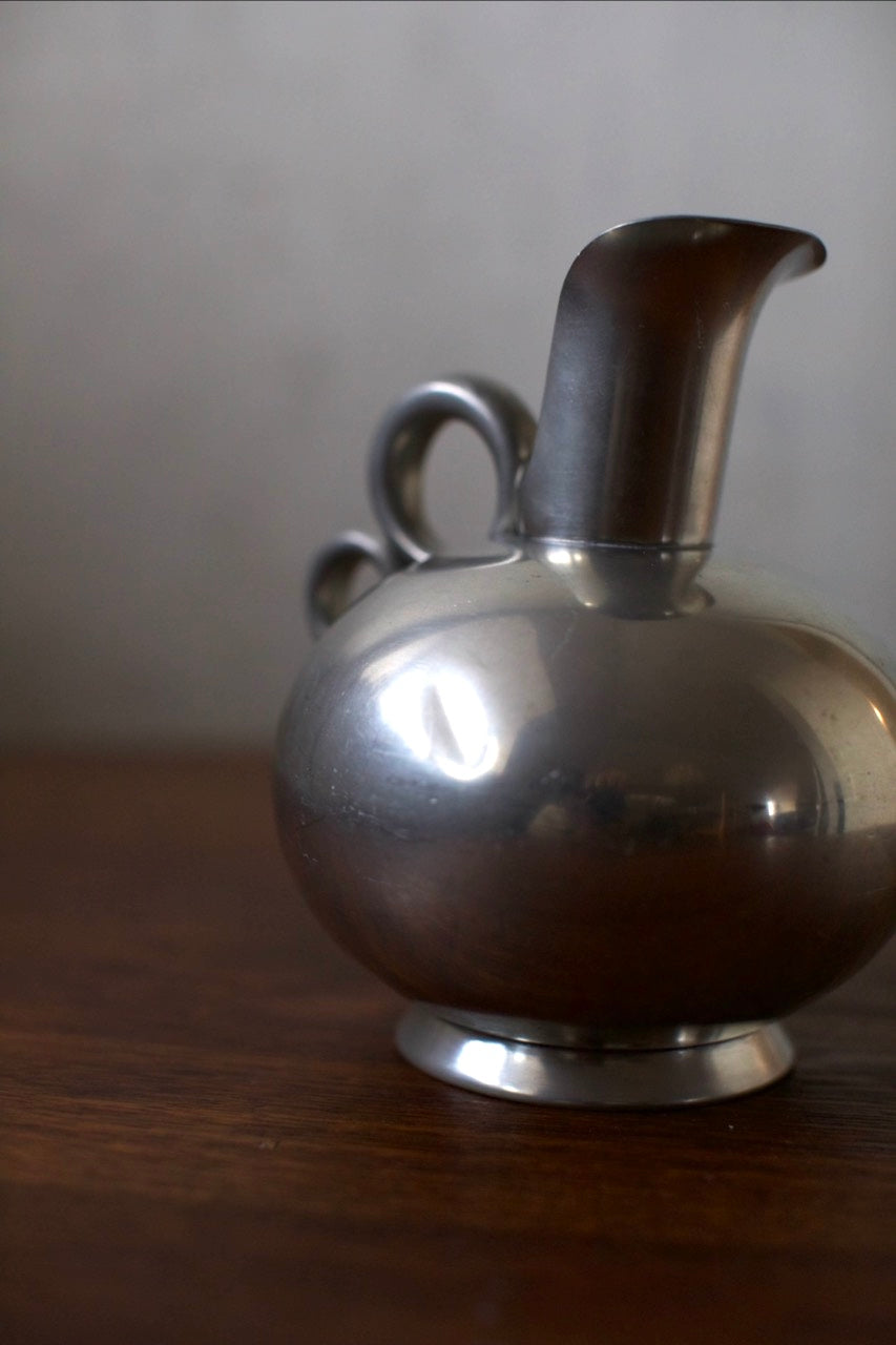 Tin Vase — back view highlighting polished metal finish