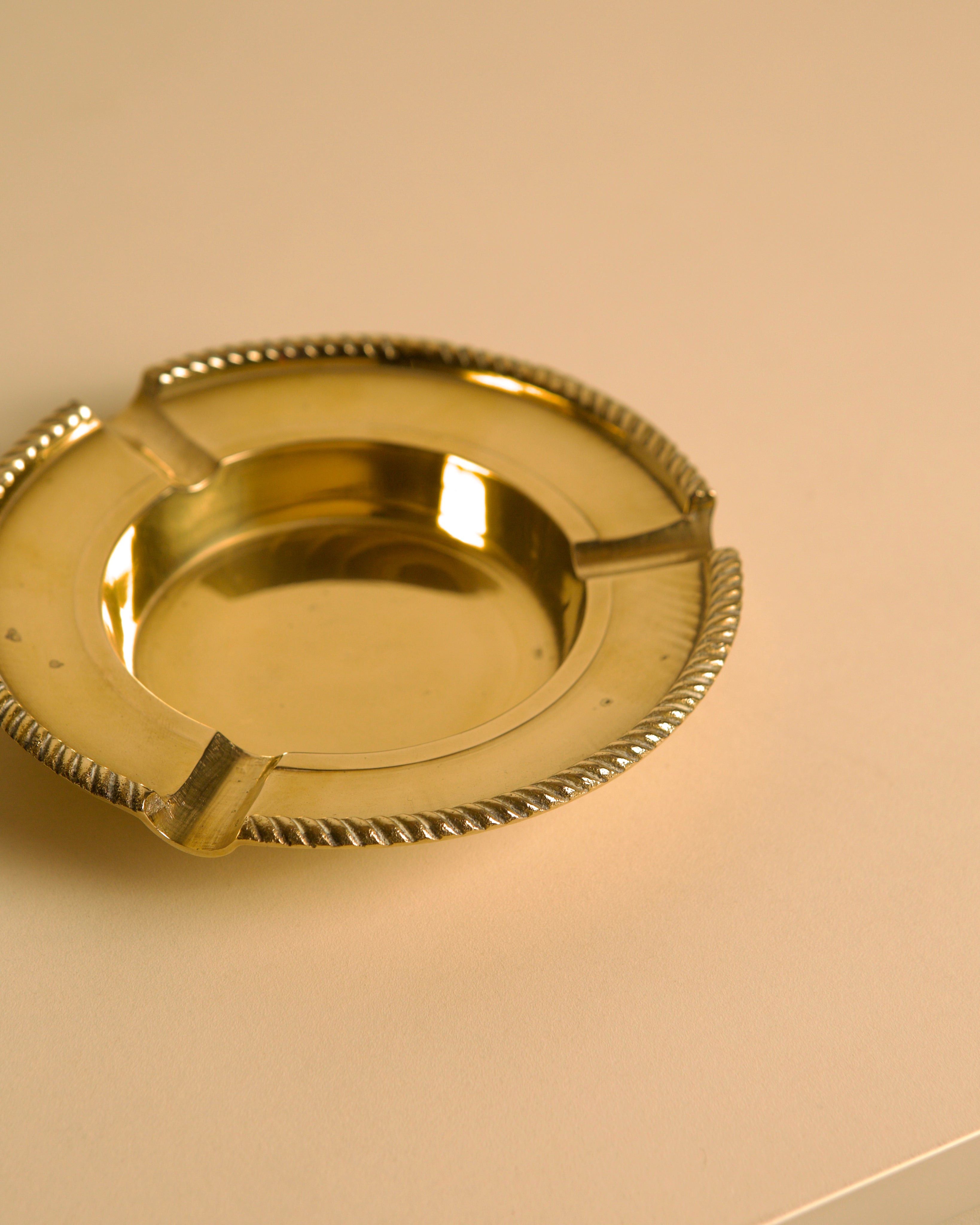 Italian Brass Ashtray DLG Jean Després 60's — close-up of polished brass surface