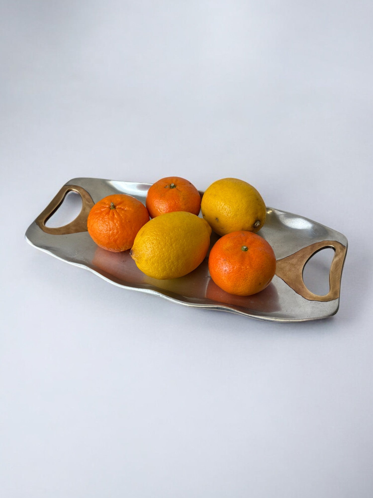 Brutalist Centerpiece by Ardisur, Bronze & Aluminium, Spain, 1970's — styled with citrus fruits on light background