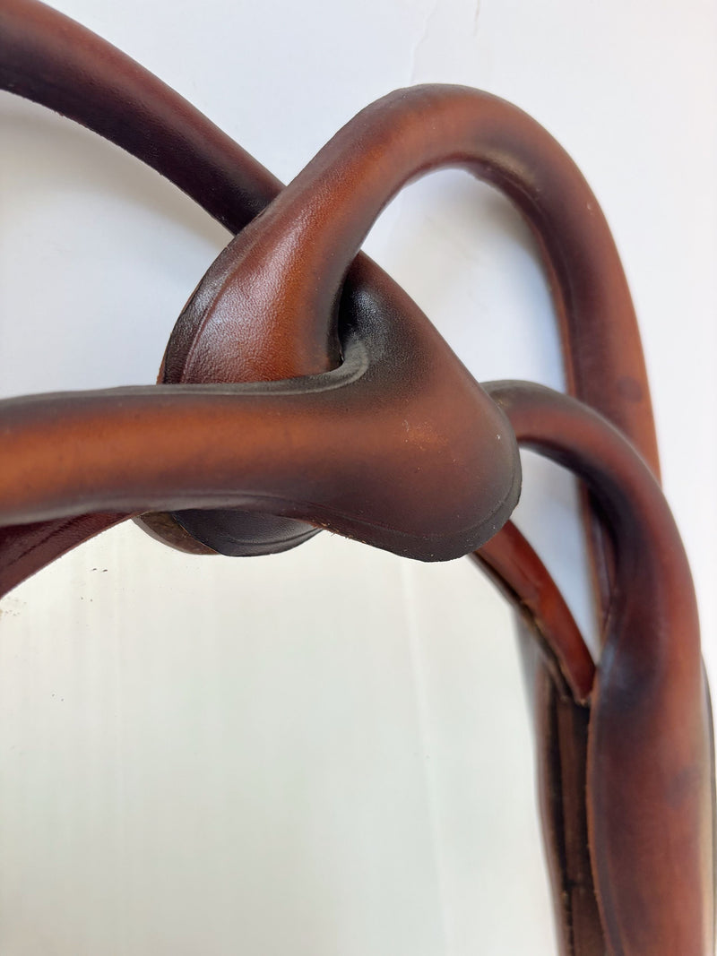 Close-up detail of leather knot frame construction on Polish mirror
