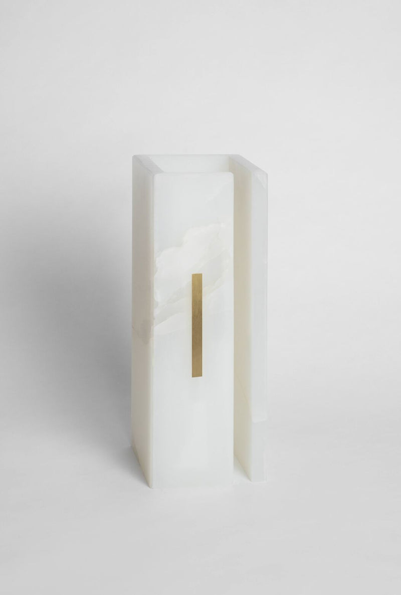 03C PURE WHITE ONIX Collectible Lighting in Stone and Onyx — close-up of onyx surface with brass accent