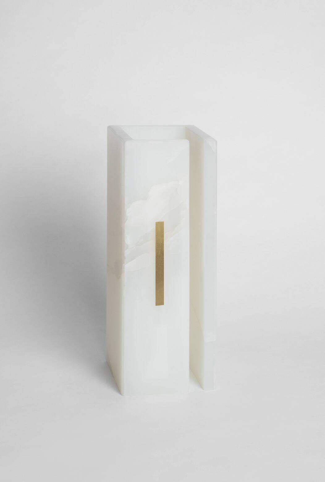 03C PURE WHITE ONIX Collectible Lighting in Stone and Onyx — close-up of onyx surface with brass accent