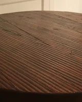 Circular wooden table — in context
