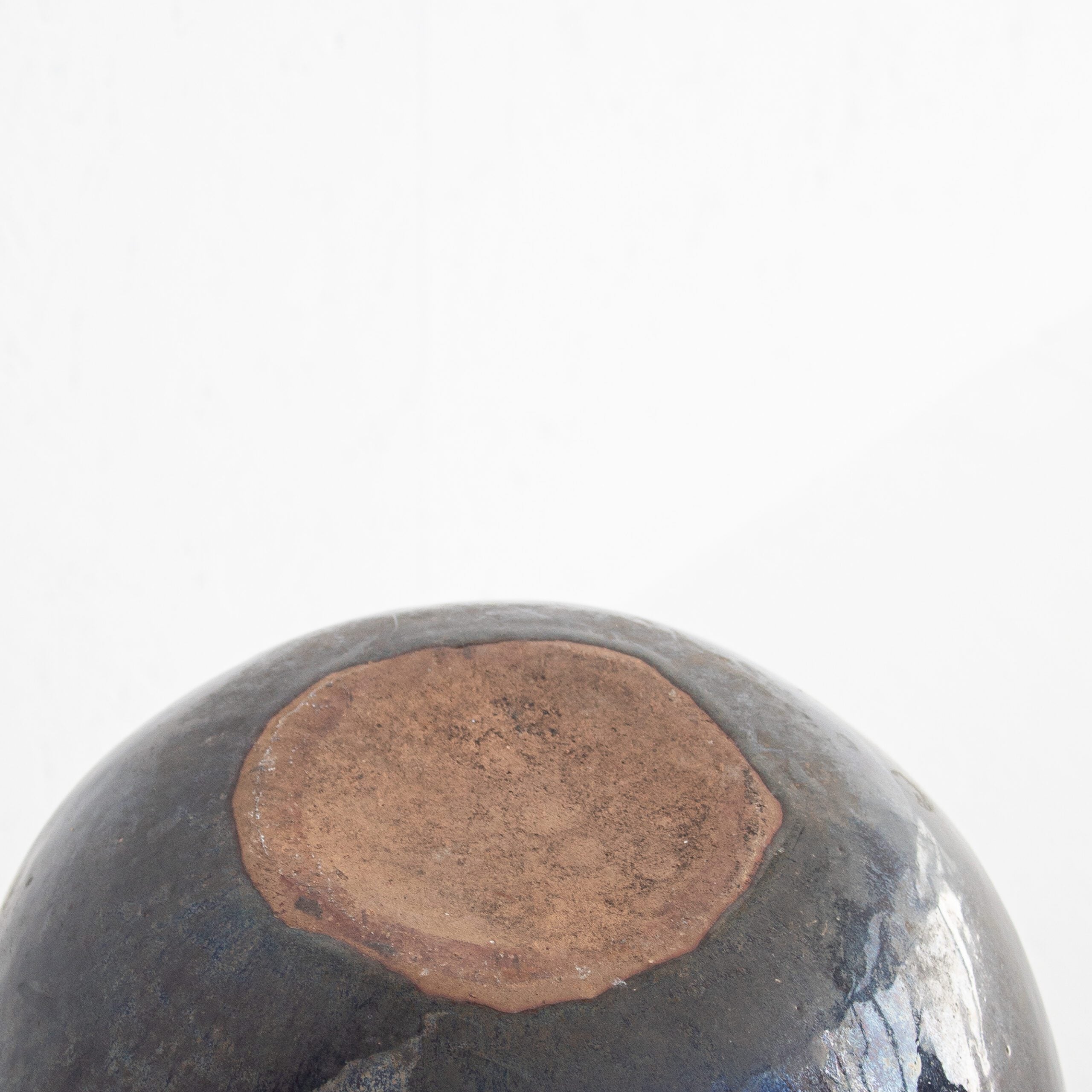 Vintage Spherical Ceramic Vase — close-up of ceramic base with earthy tones