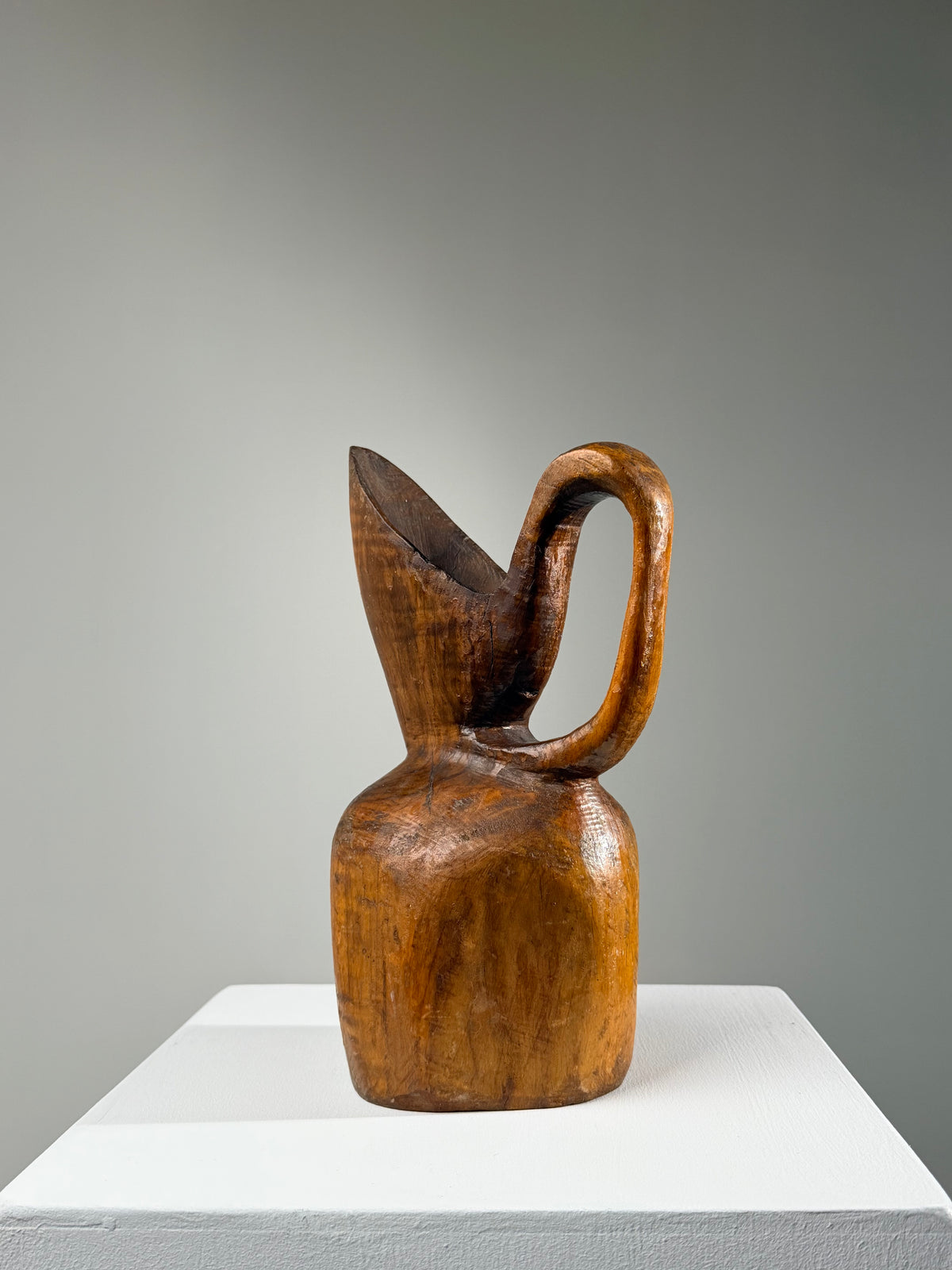 Carved olive wood pitcher, France, early 20th century.  — side angle