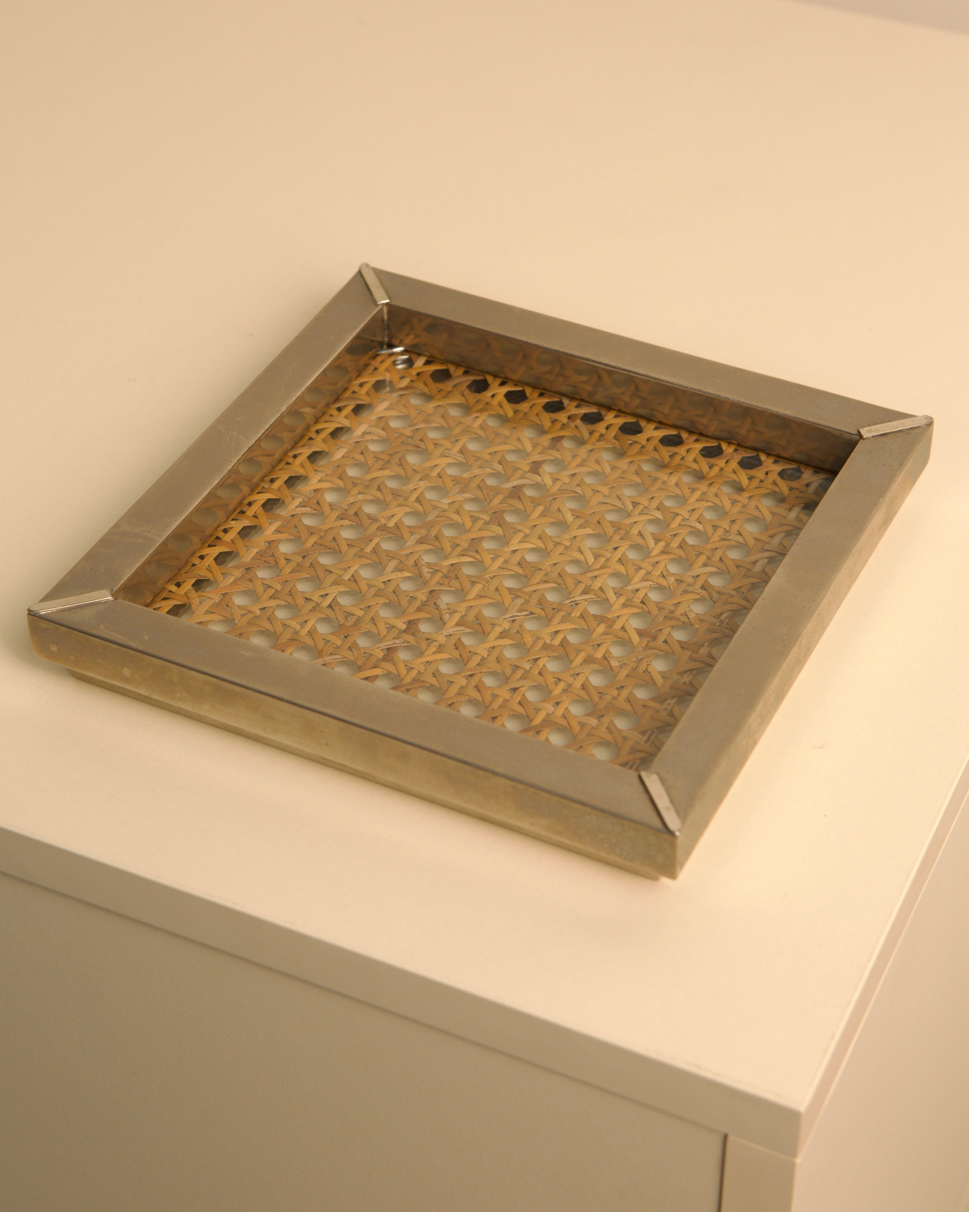 Italian 70s brass-framed vide-poche with woven cane insert detail