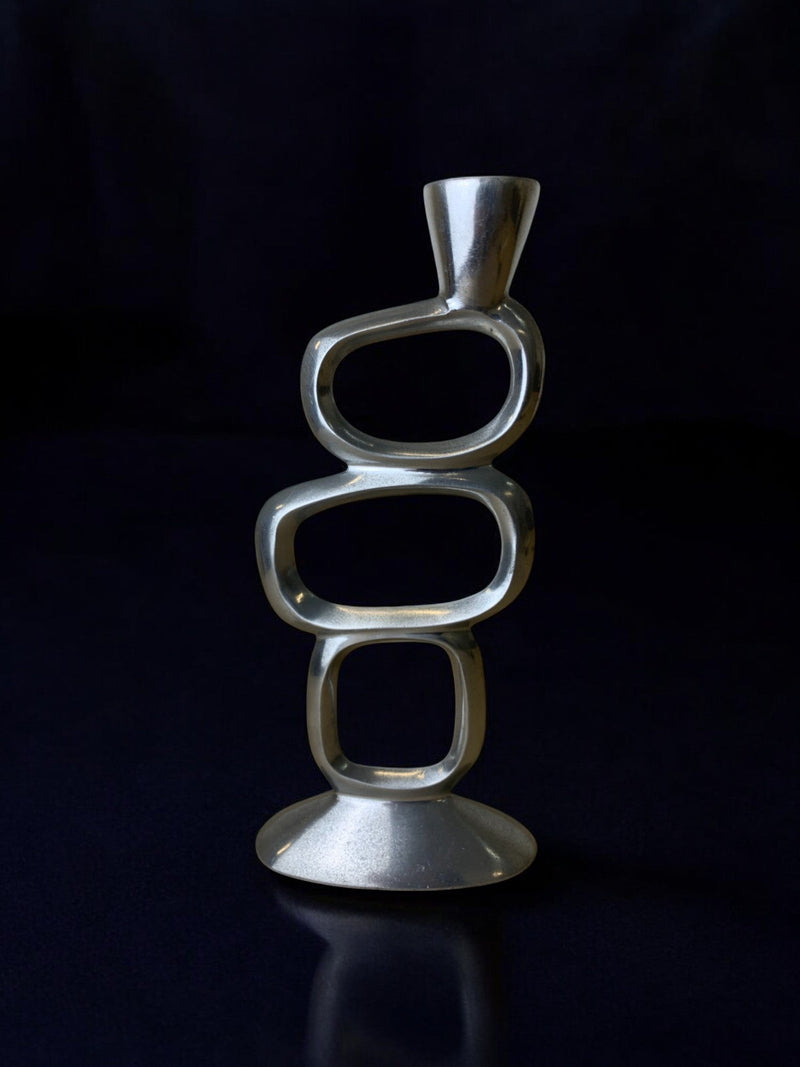 Circle Candleholder by Matthew Hilton, 1980's — close-up of polished metal design
