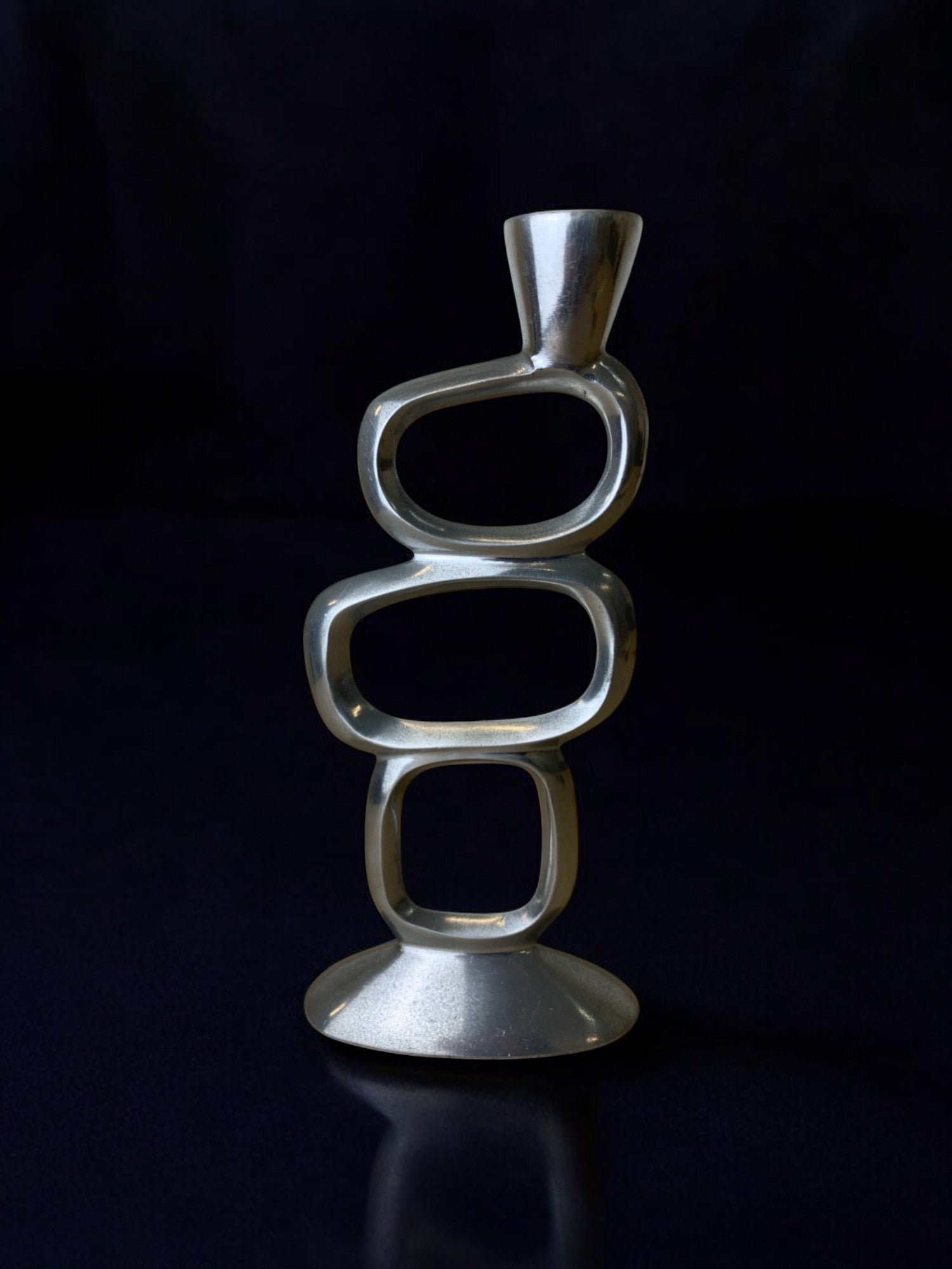 Circle Candleholder by Matthew Hilton, 1980's — close-up of polished metal design