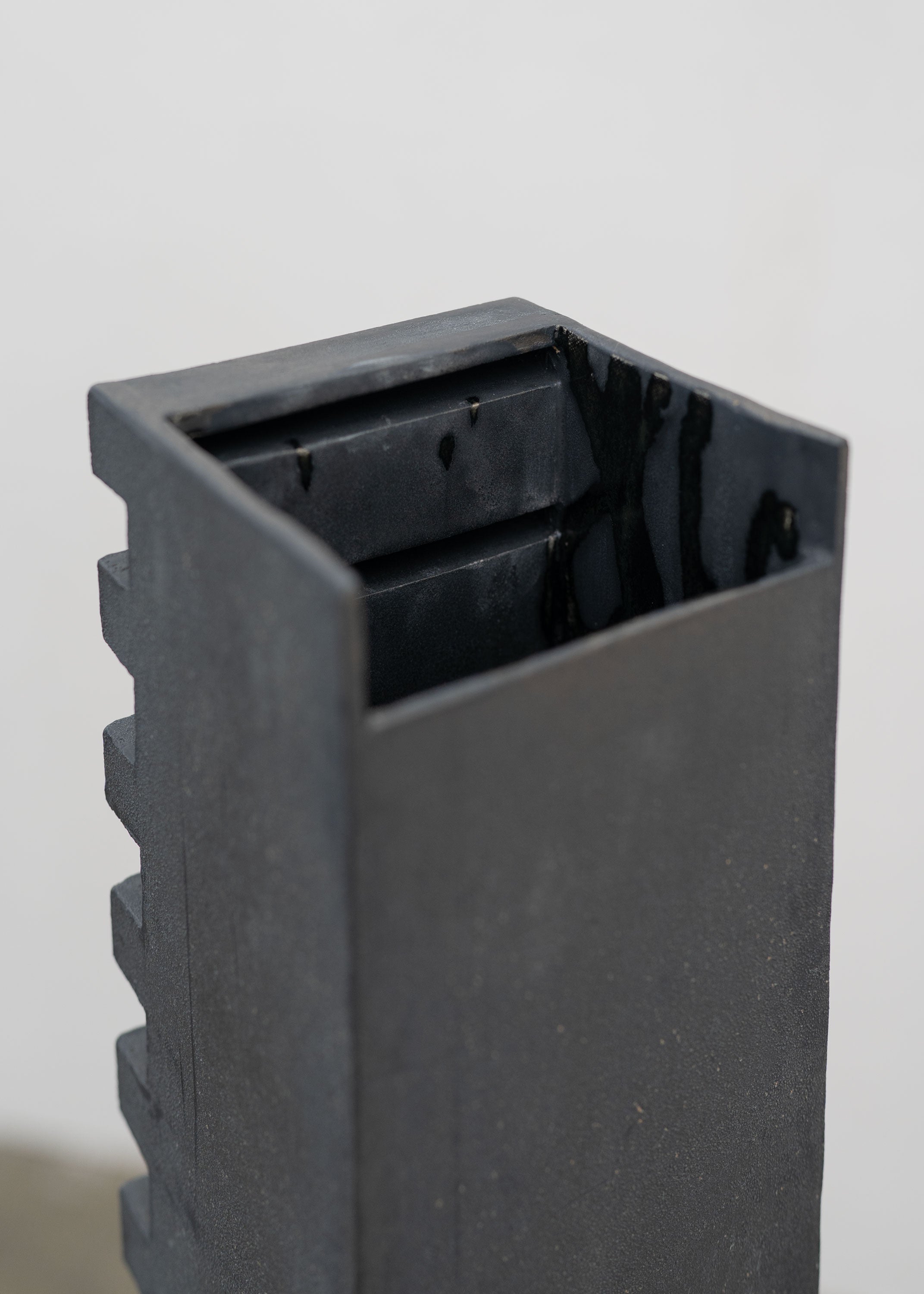 Tall Sculptural Stoneware Vessel by Tom Roberts — close-up of textured black surface