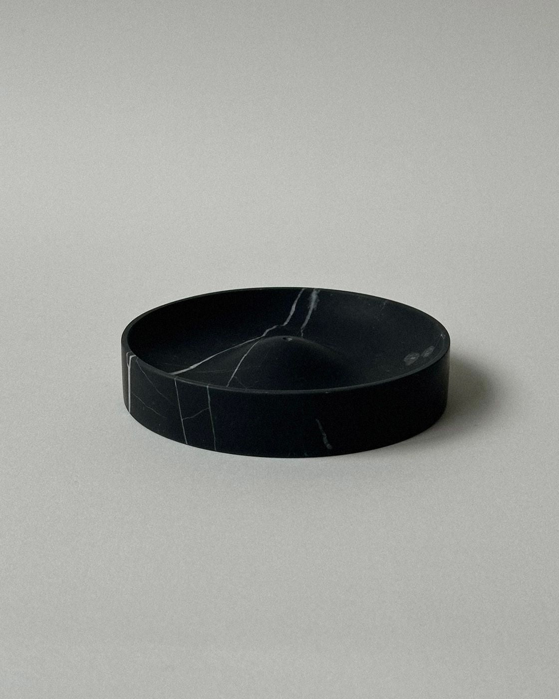 ALTAR' incense holder — close-up of black marble surface