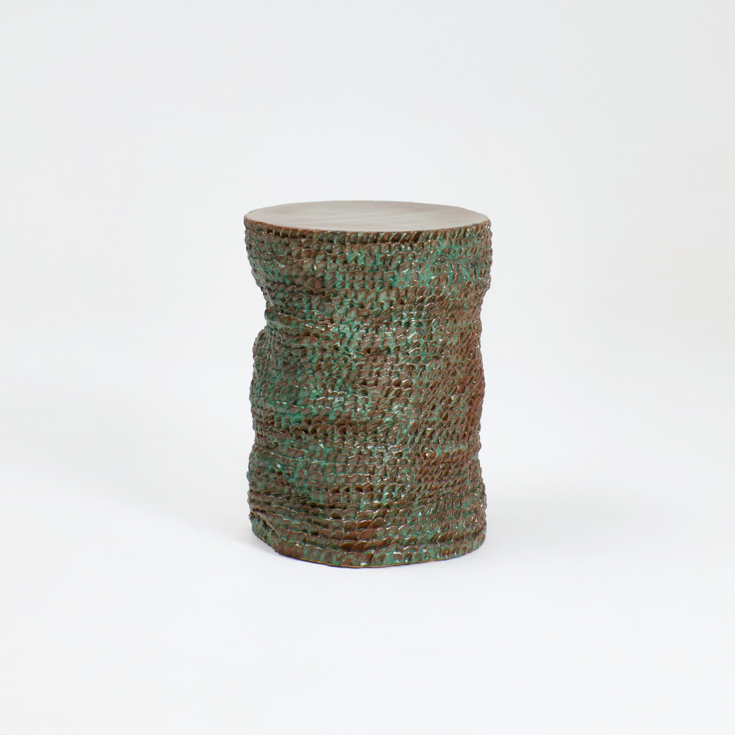 Casa Ceramic Side Table — top view of textured green ceramic surface