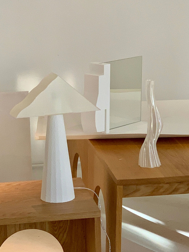 Cloud Lamp — close-up of white paper shade on wooden table