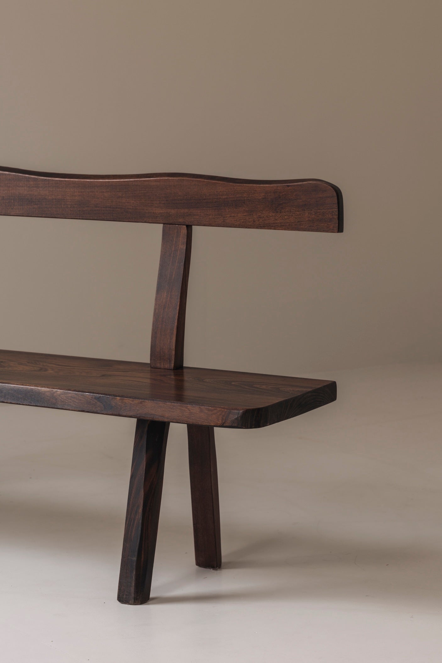 Sculptural Bench by Olavi Hanninen for Aranjou, France 1950s — angled view of dark wood seat and backrest