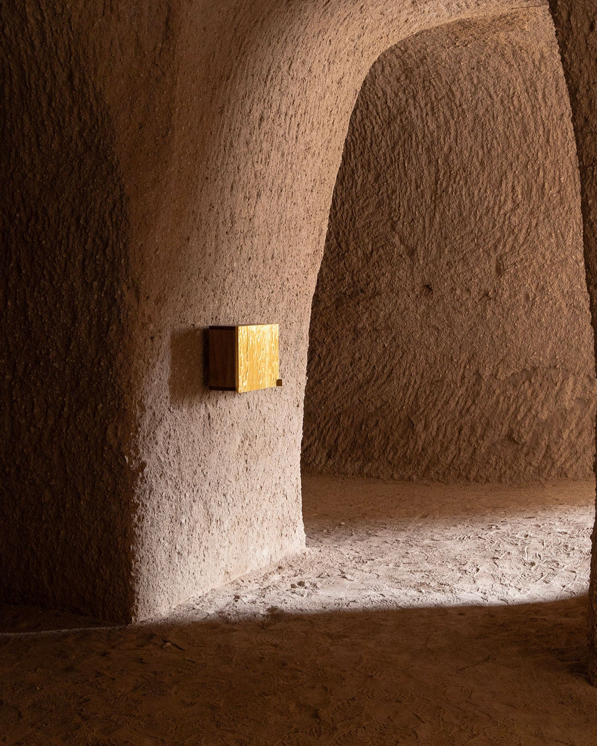 AURUM' Wall Box Cabinets 23k Gold Leaf — mounted in textured stone alcove