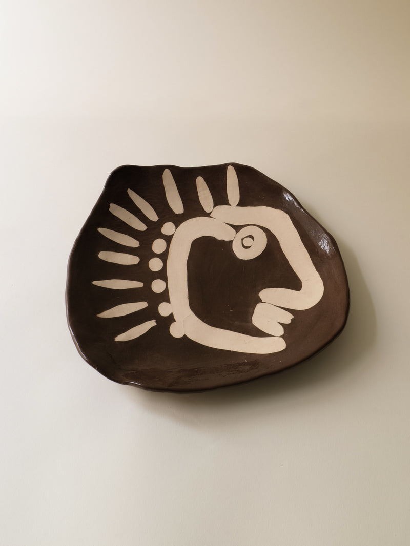 Brown ceramic plate with cream bird motif, modernist 1950s design