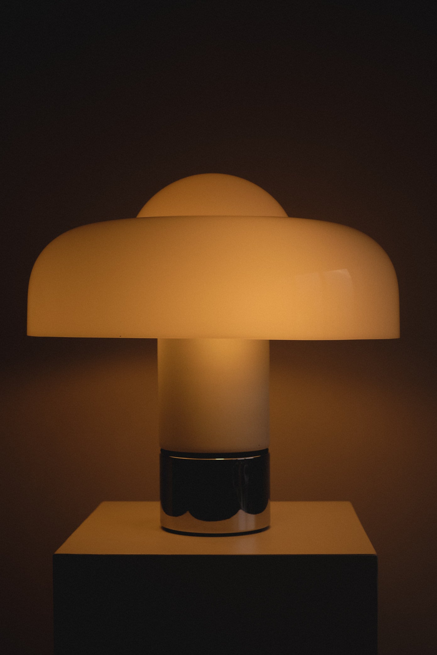 Brumbry Table Lamp by Luigi Massoni for Harvey Guzzini — side view with glowing glass shade