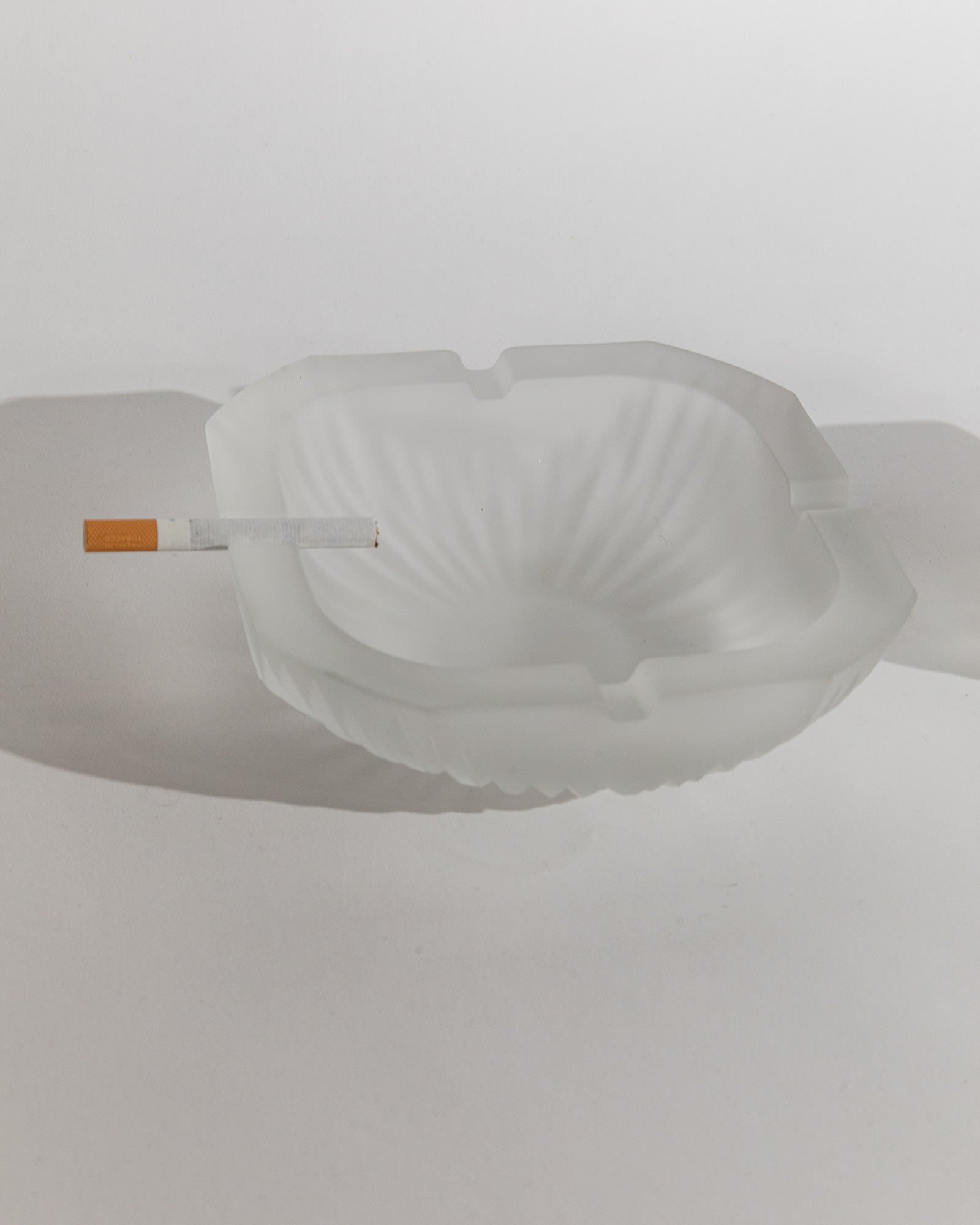 Vintage 1970s Smoking Set, Frosted Textured Glass Ashtray — top view with cigarette