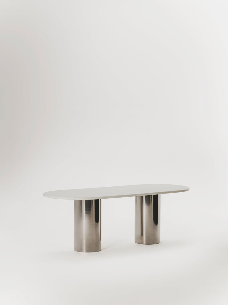 Seho Dining Table — side view of oval white top and metal base