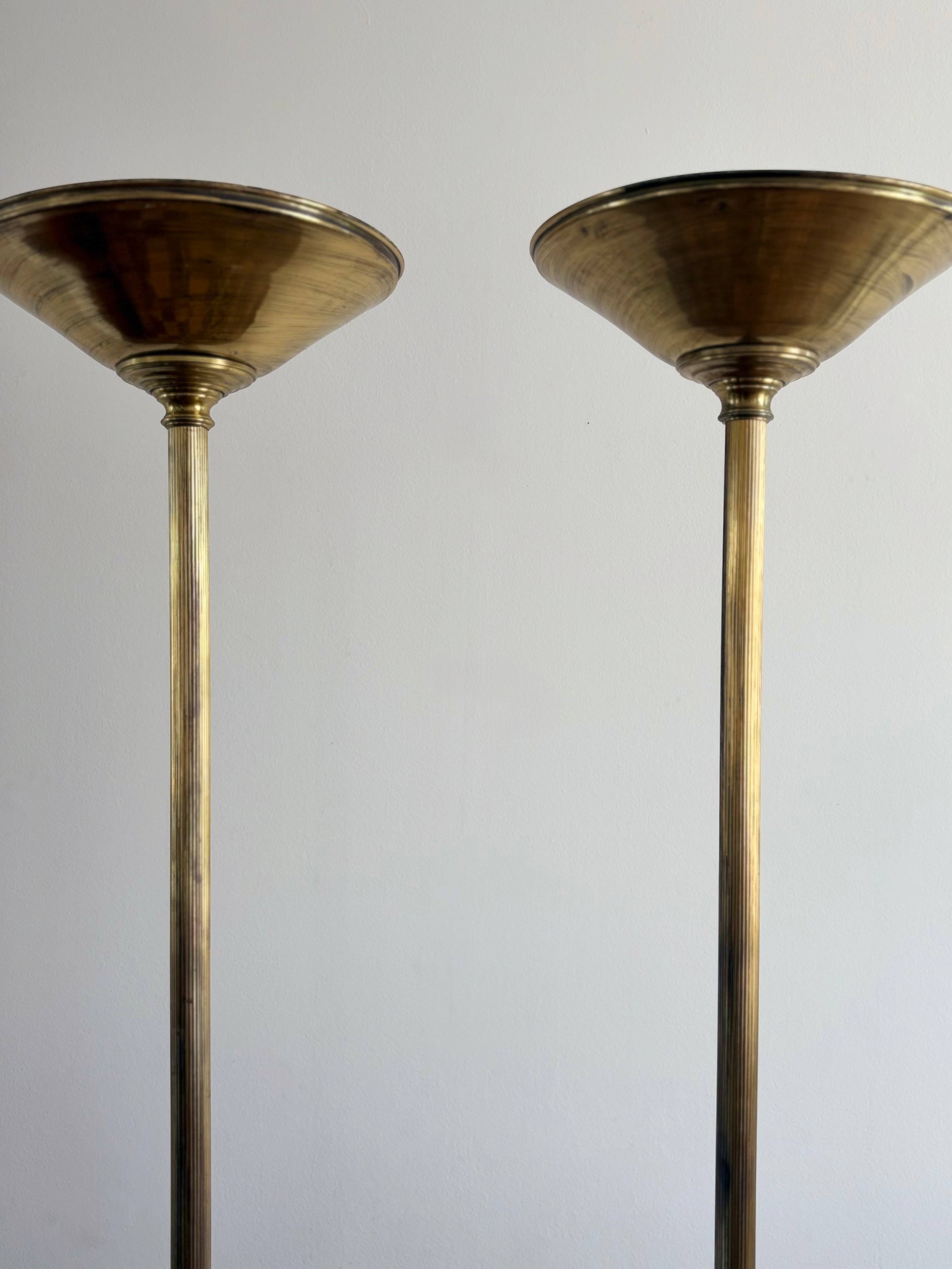 Pair of Monumental Brass Swan Torchères from the Hotel Ritz Lisbon — lifestyle setting