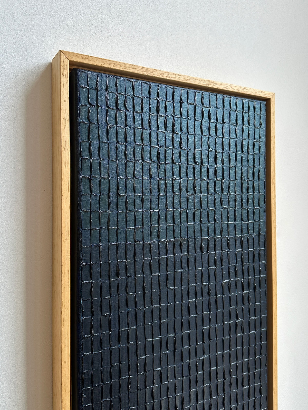 Prussian blue textured painting detail showing raised geometric pattern