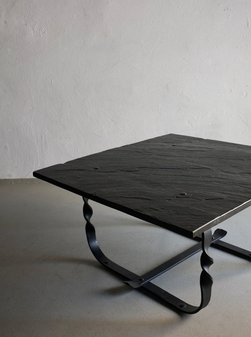 Brutalist Coffee Table 1970s — close-up of black stone top and metal base