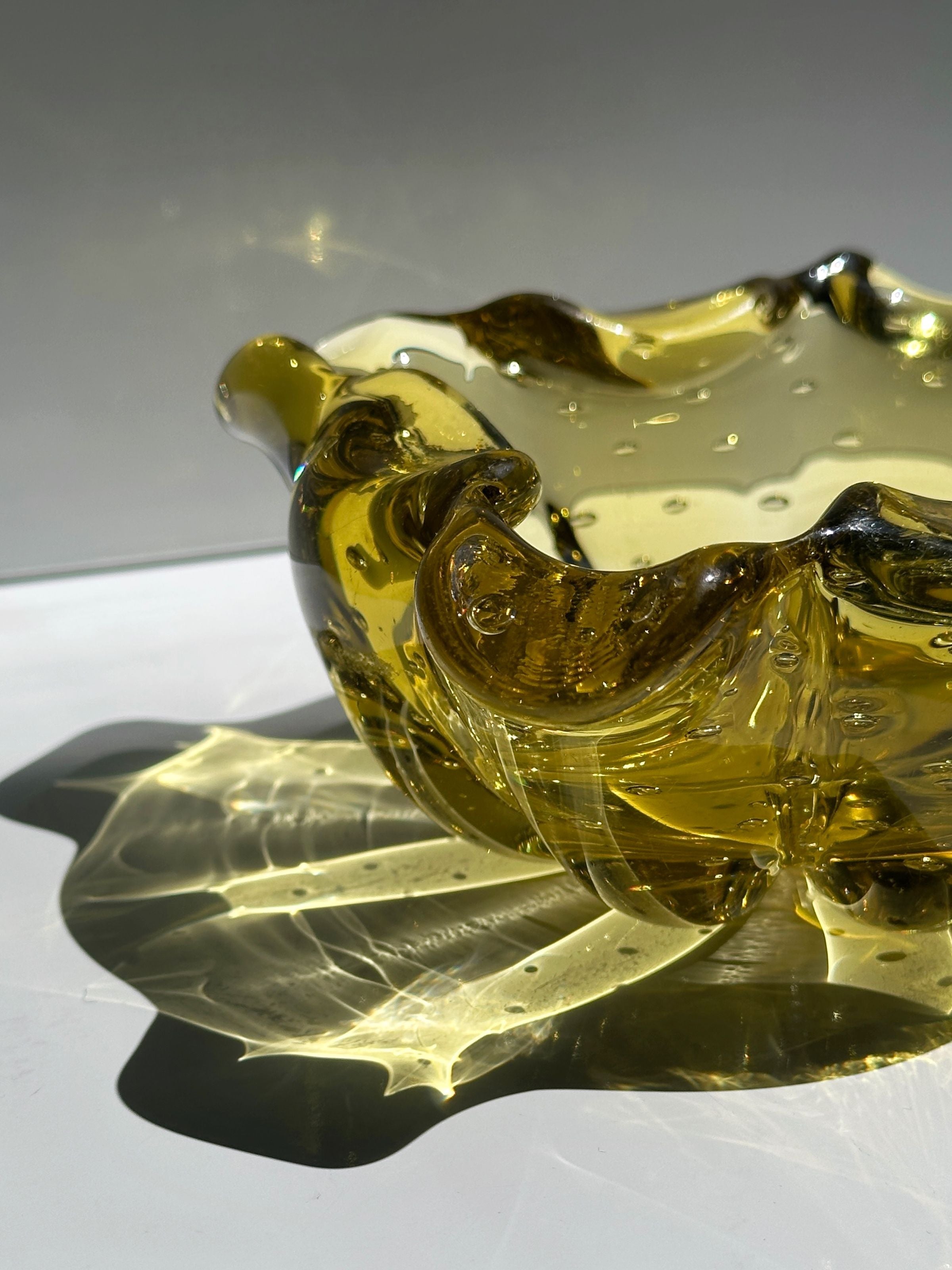 Golden Murano glass ashtray detail showing bullicante bubbles