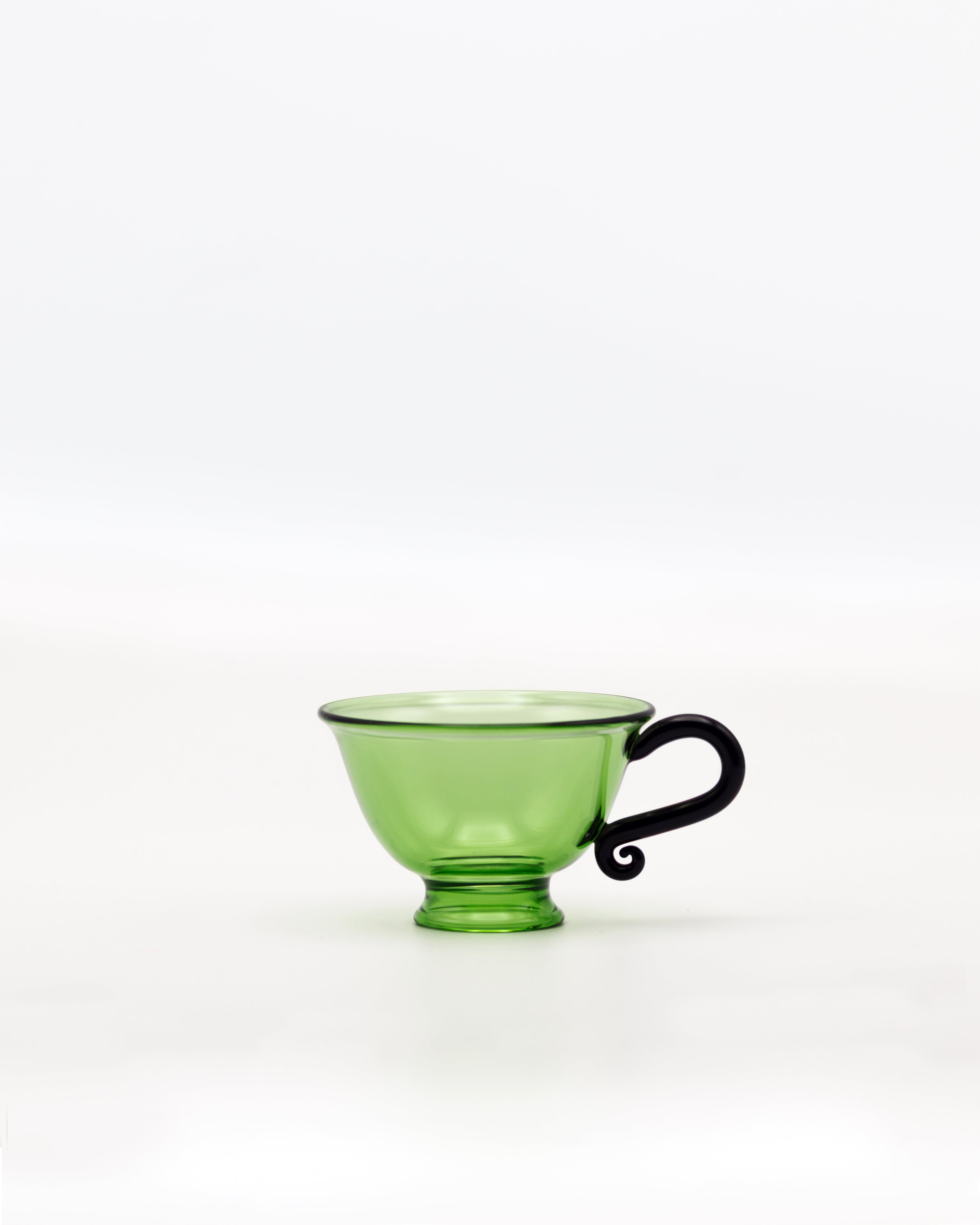 L'Espresso Set — top view of green glass cup with black handle