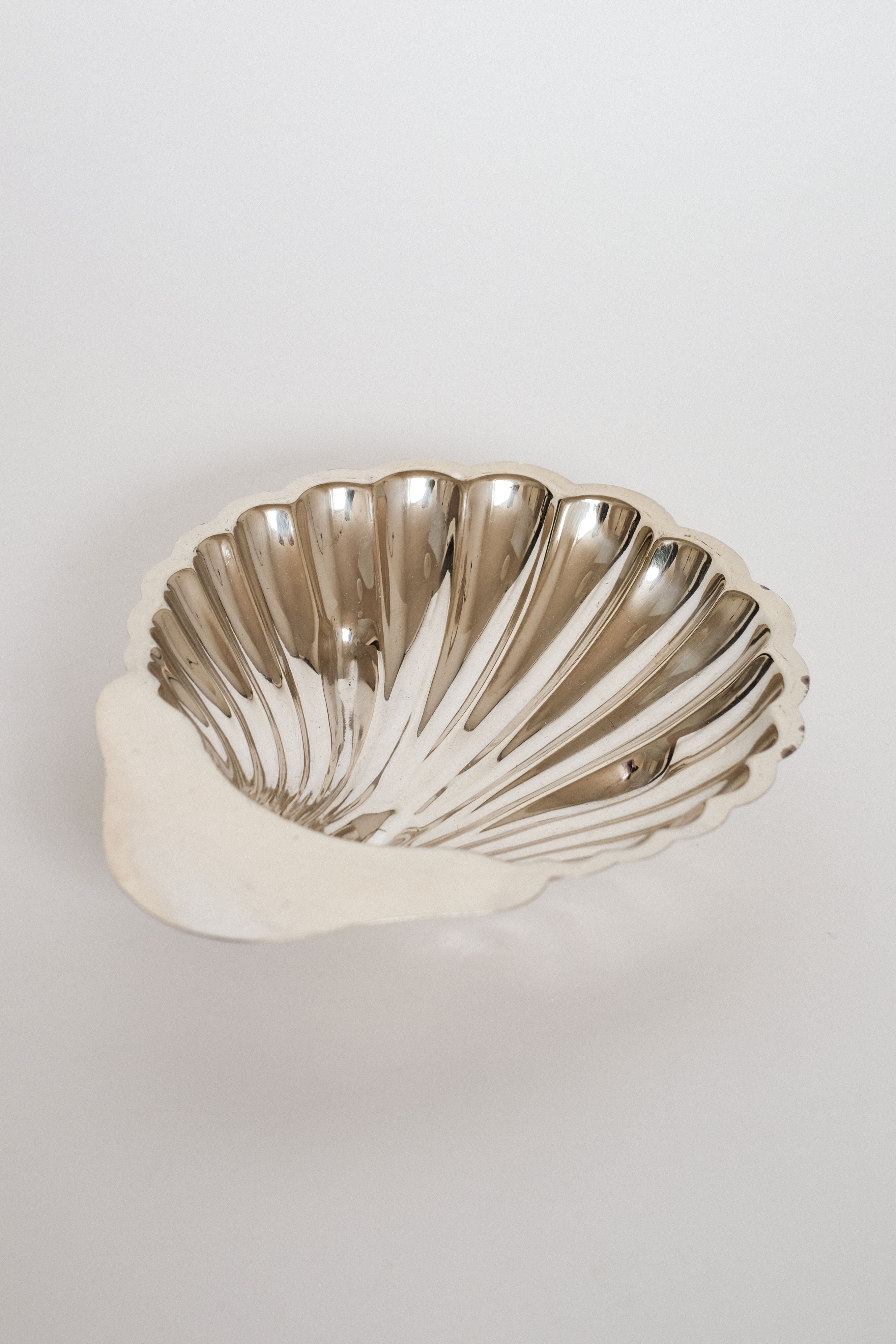 Medium Shell Shaped Vide-poches — close-up of polished silver surface