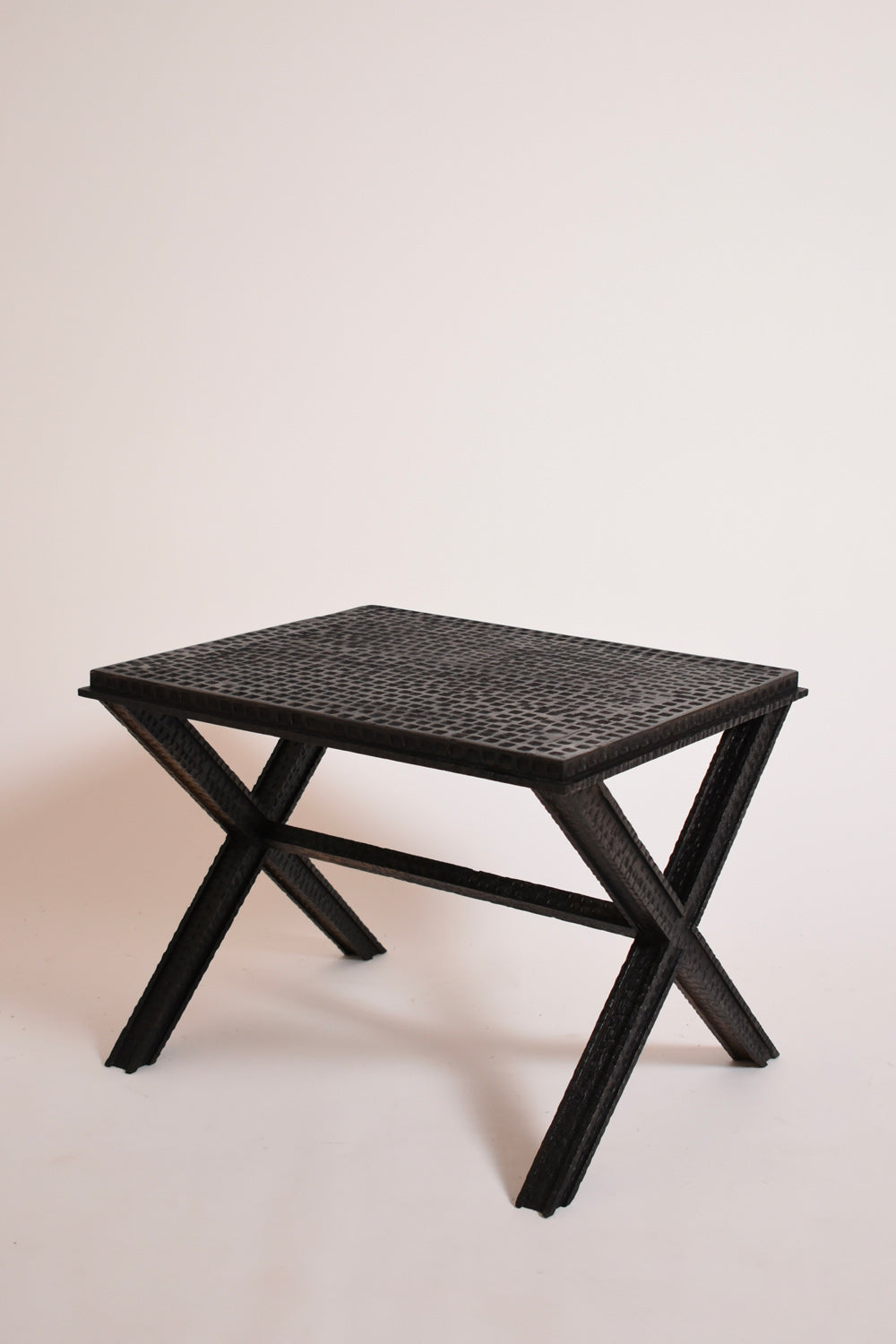 Brutalist Gouged Wood Coffee Table — side angle showing textured black surface