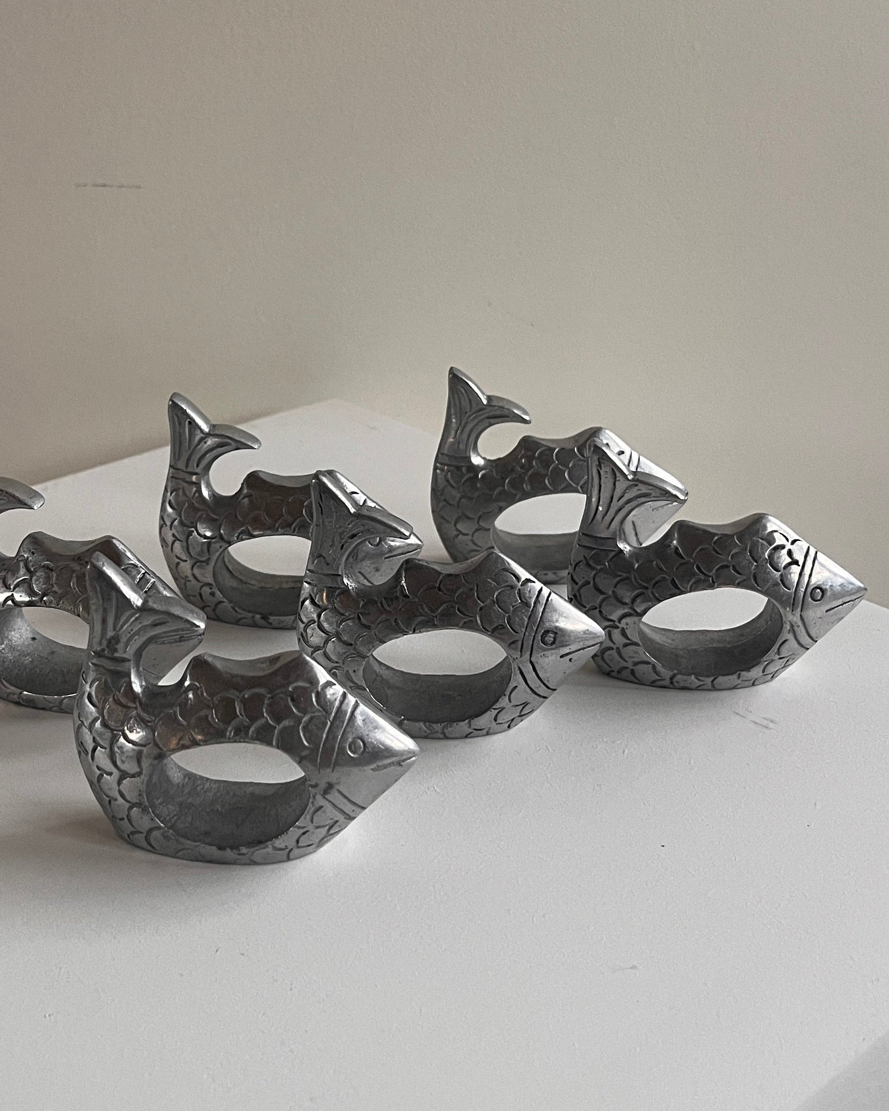 Pewter Fish Napkin Rings - Set of Six — close-up of detailed fish design