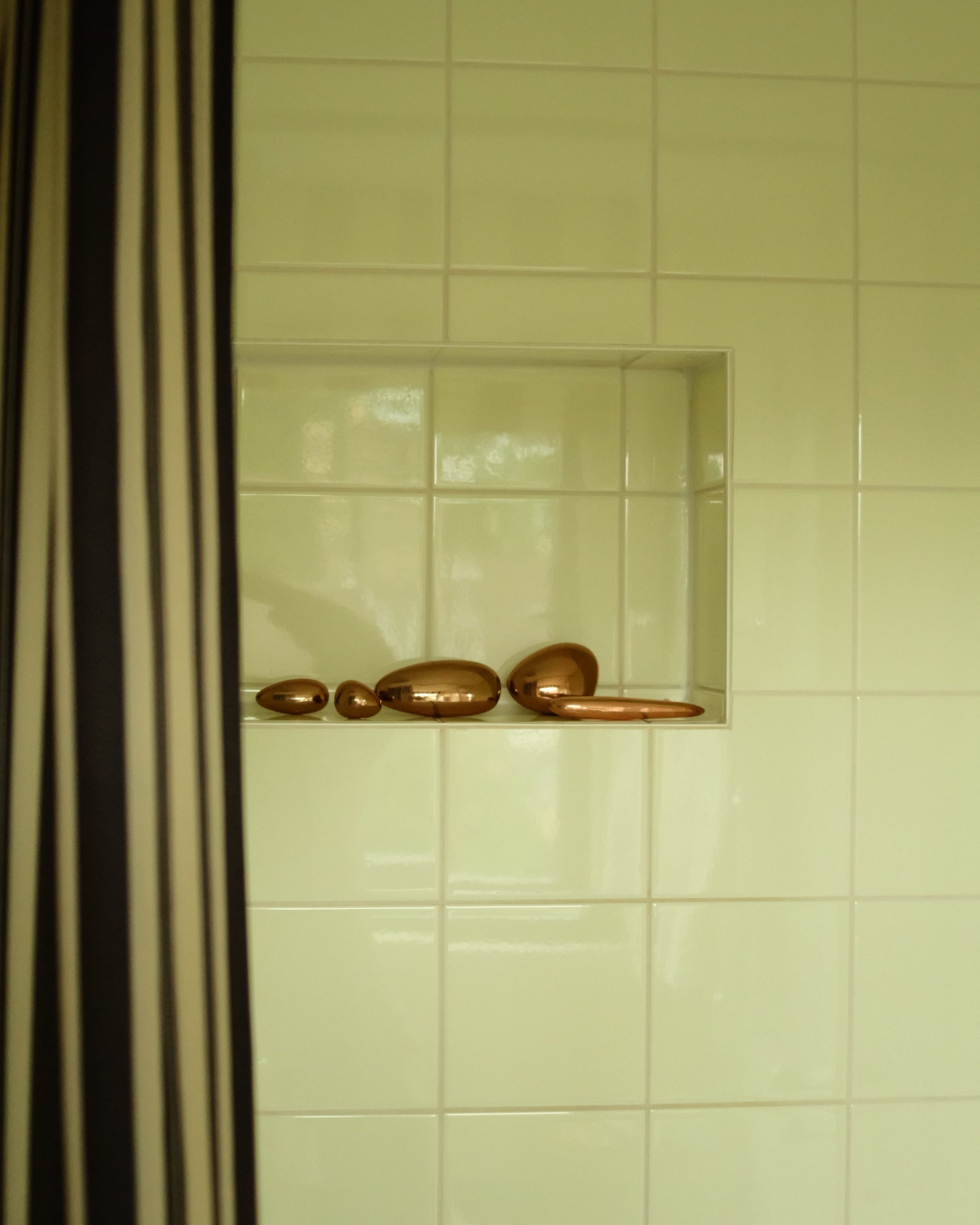 MOMI Cabinet Knob/Wall Hook Short — bronze knobs displayed in bathroom nook