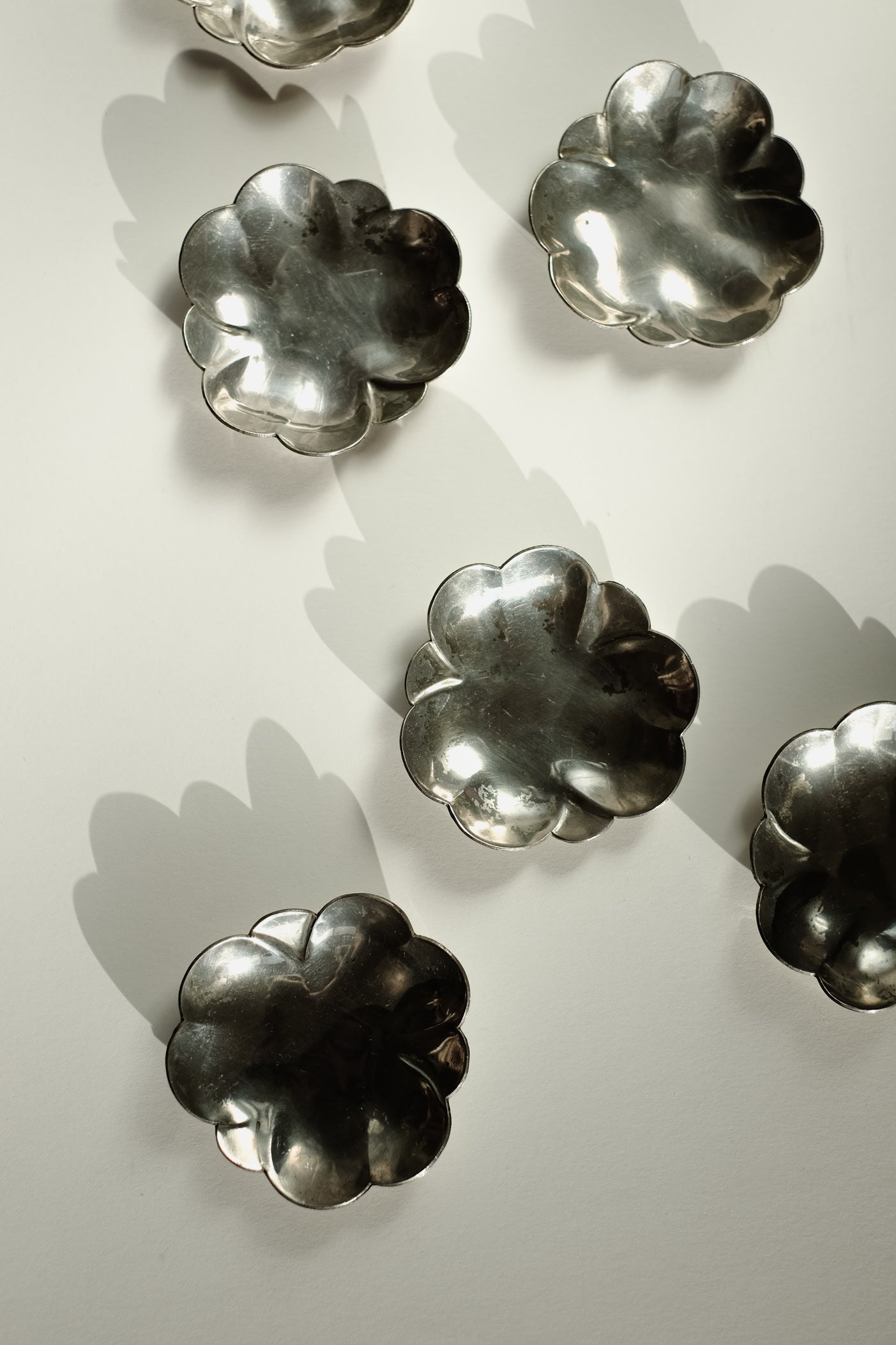 Set of 6 Small Dishes — overhead view of silver metal dishes