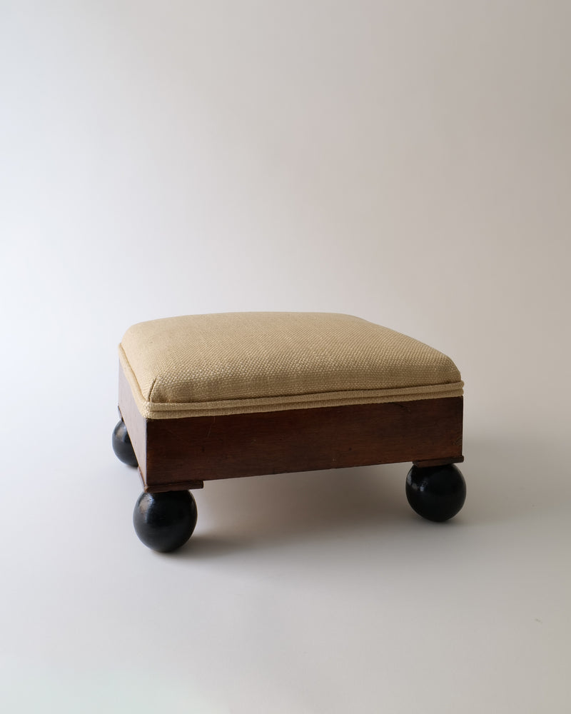 Beige upholstered Swedish ottoman on dark spherical feet, 1800s