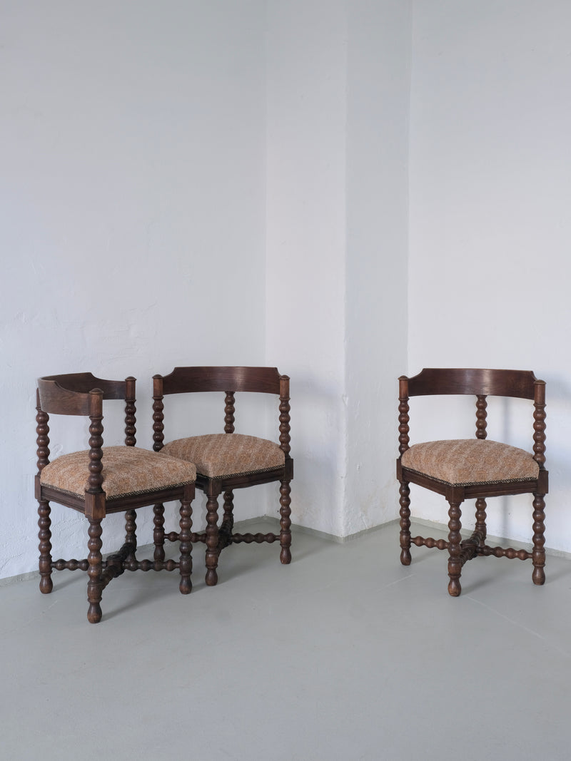 Three antique bobbin turned corner chairs with upholstered seats
