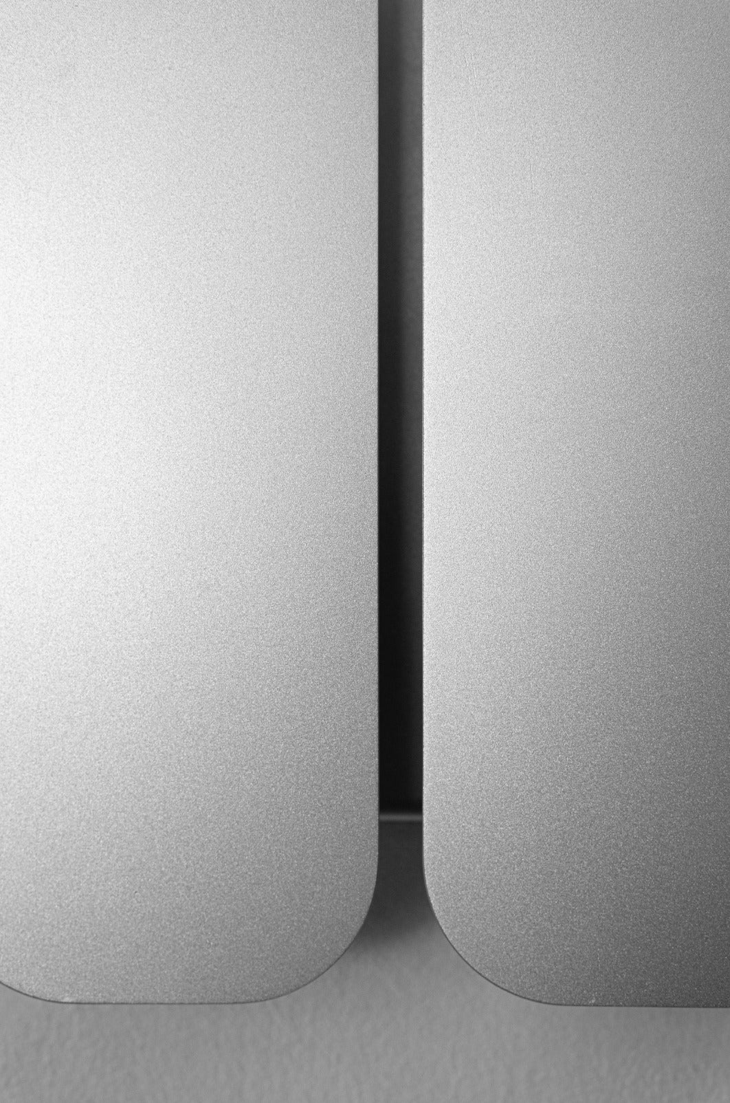 Wall Lamp - 1.0 - Double -Stainless Steel — close-up of brushed stainless steel finish