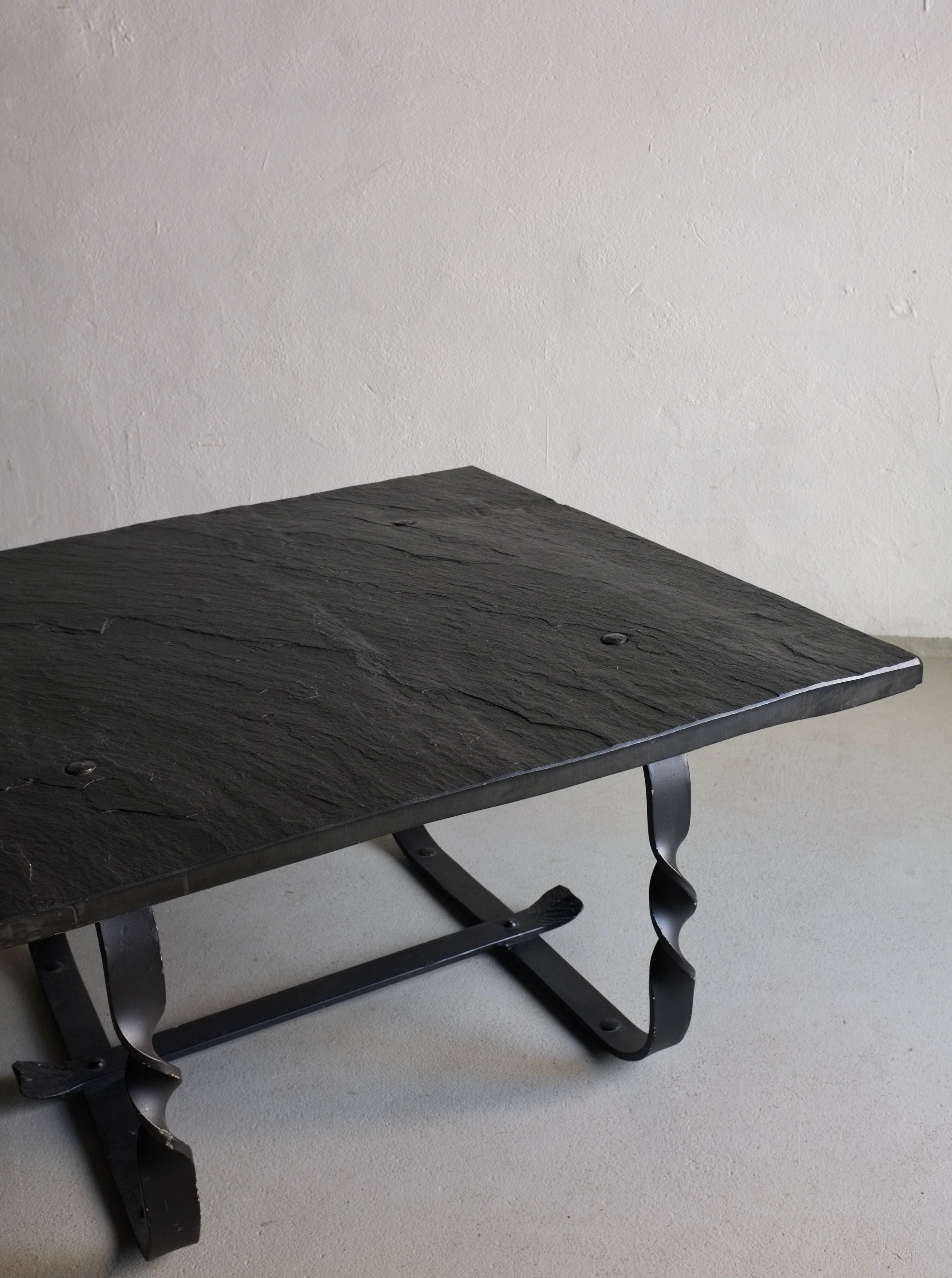 Brutalist Coffee Table 1970s — angled view of slate top and metal base
