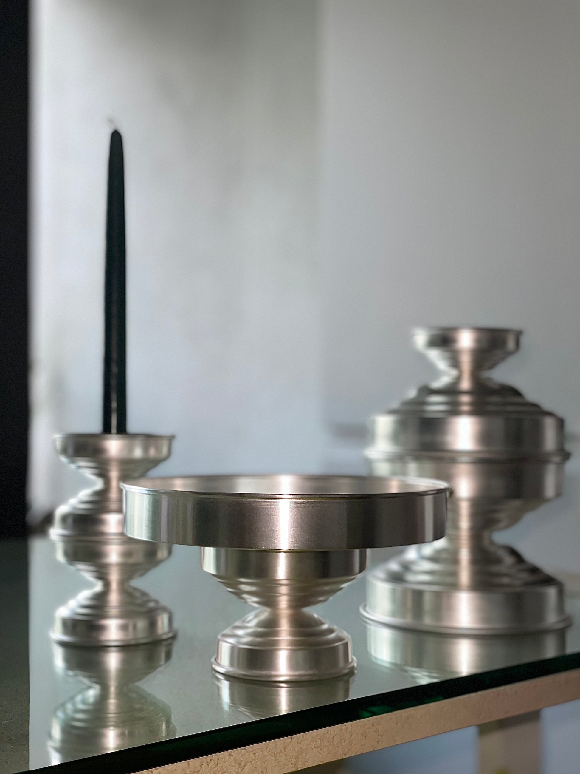 Contemporary Bowl Silver Plated — top view on glass table with candle