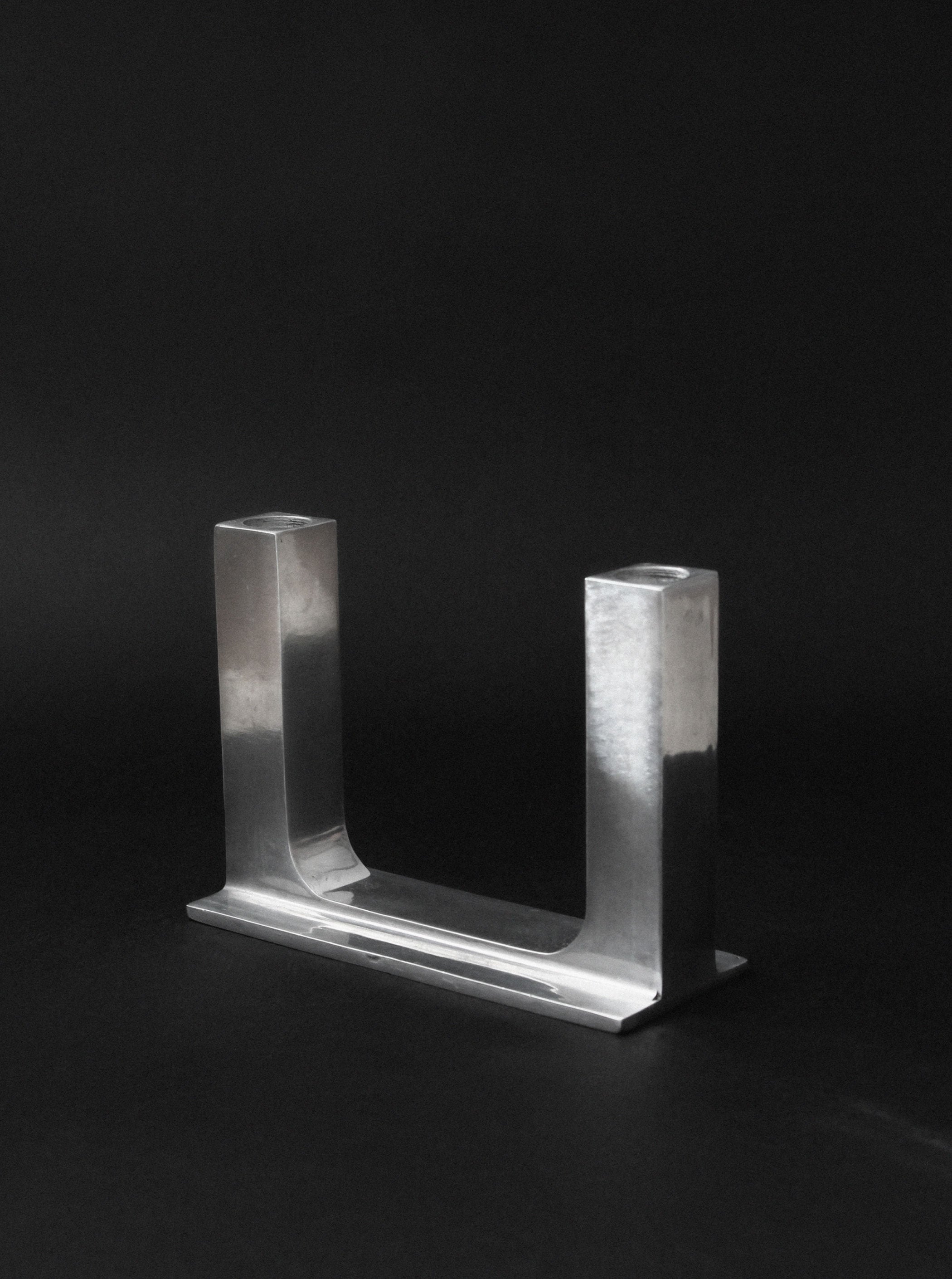 Modern brutalist aluminum candle holder U-shaped design detail
