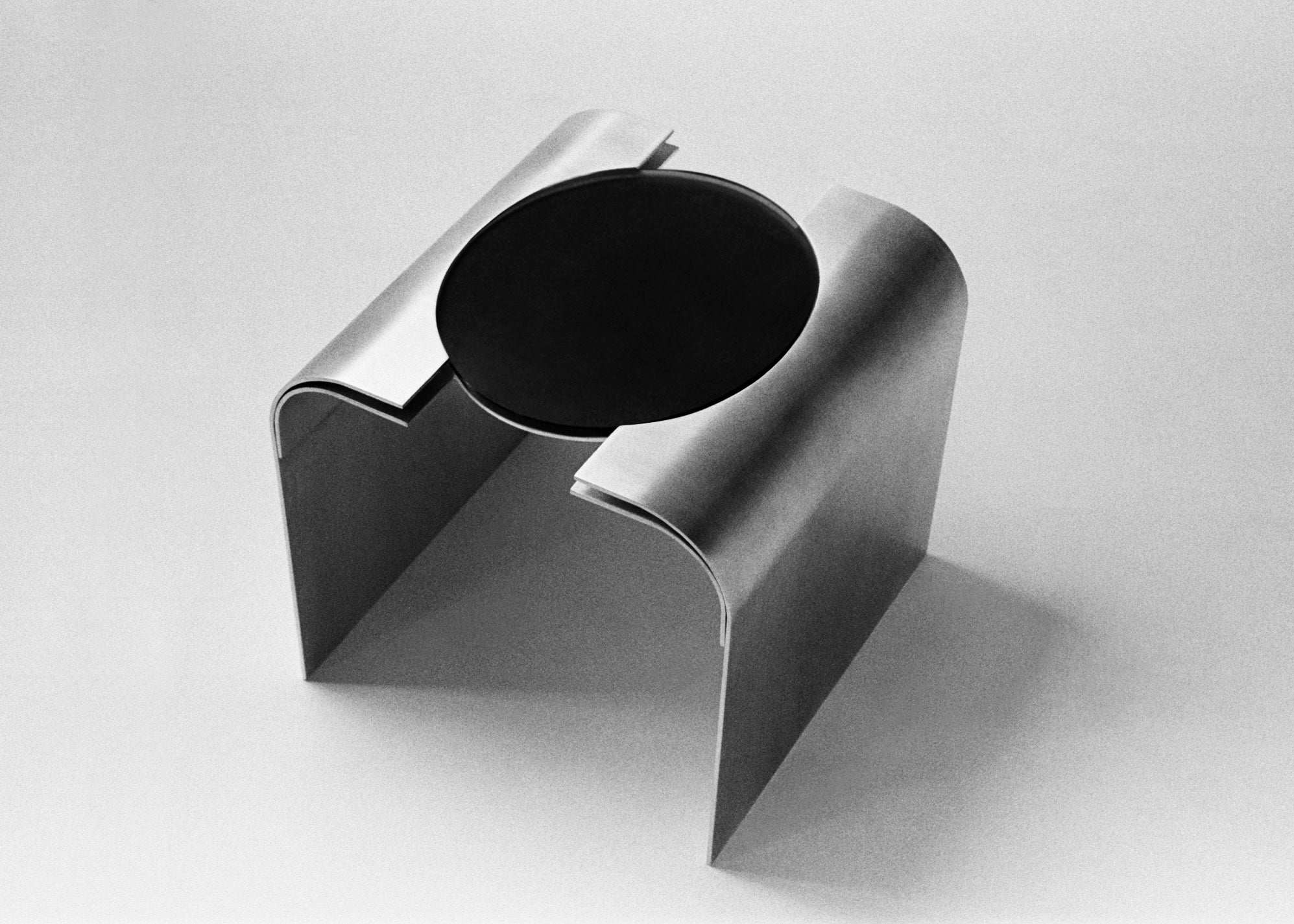 Side Table "Still Gaze" | Aluminium & Glass — top view of circular glass surface