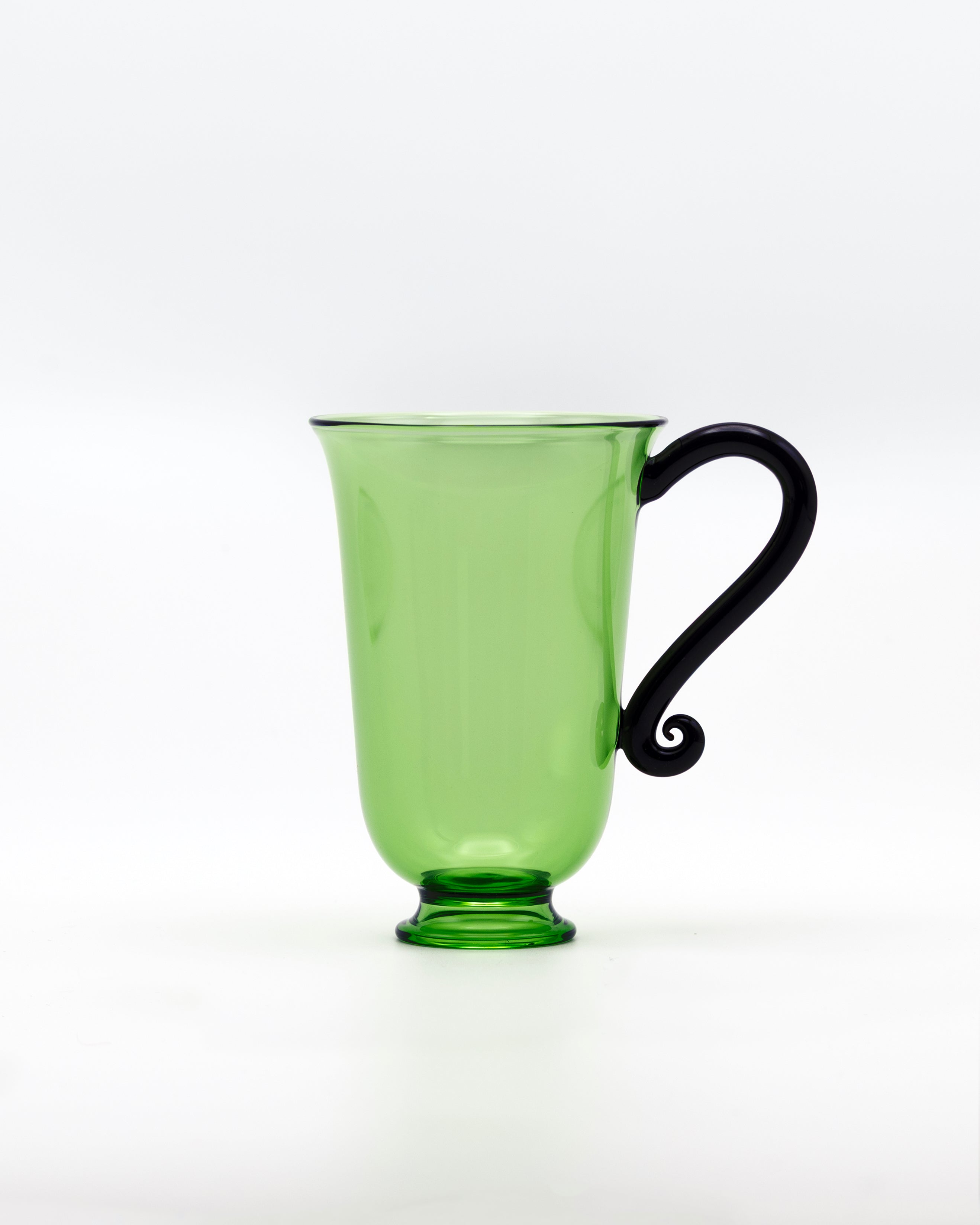 Grande Tasse Set — side view of green glass mug with black handle