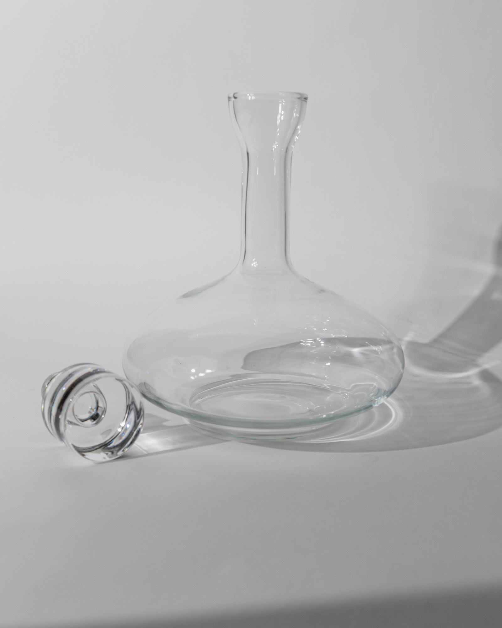 Vintage 1980s Glass Decanter, Italian Glass Ware with Glass Stopper — close-up of clear glass decanter with stopper
